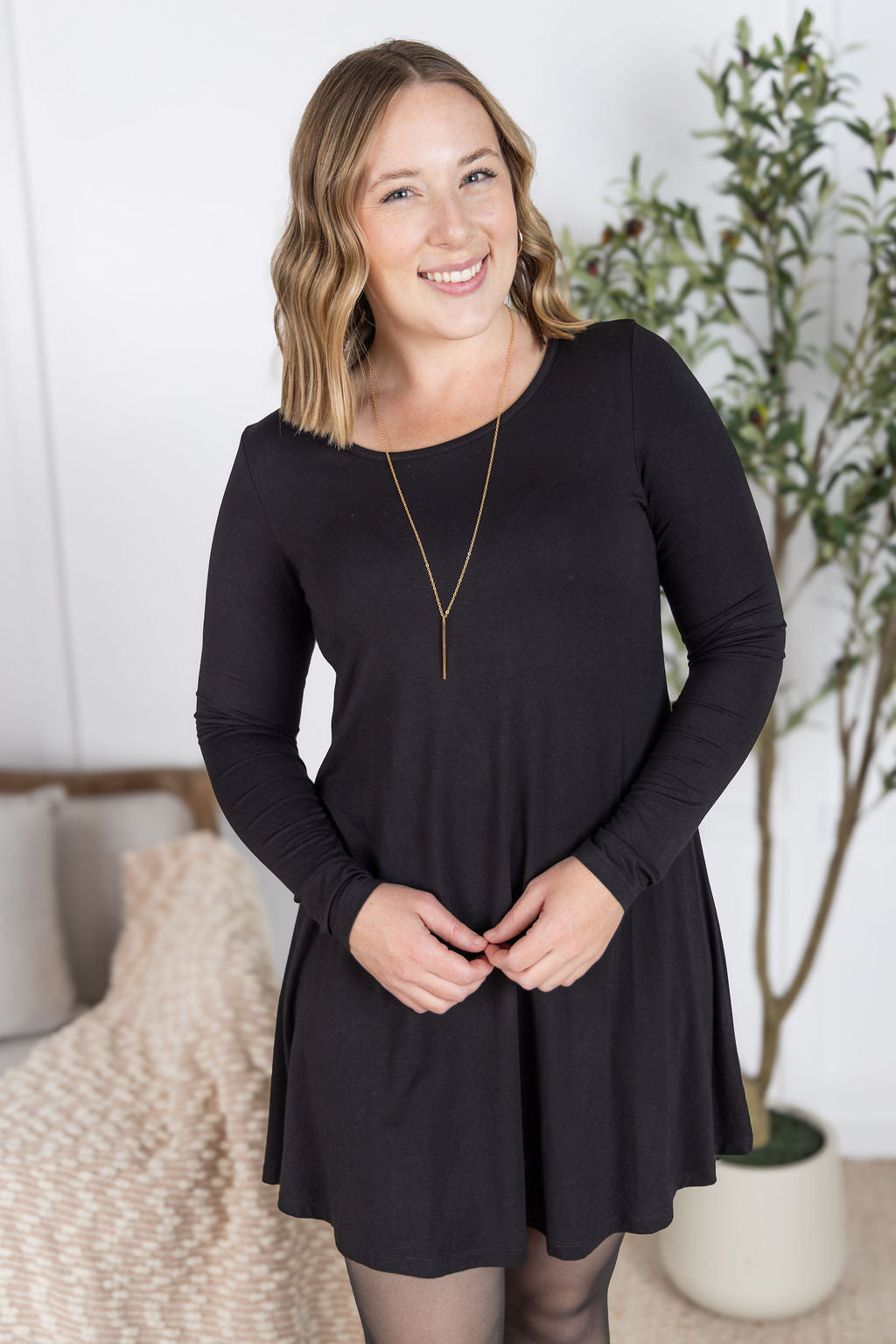 Savannah Bamboo Swing Dress in black with long sleeves and scoop neckline.