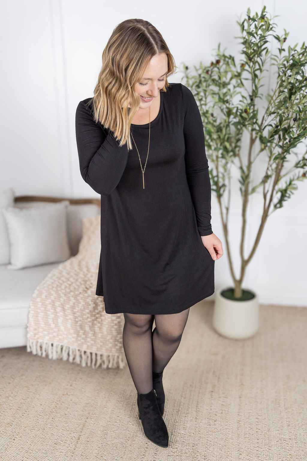 Savannah Bamboo Swing Dress in black with long sleeves and scoop neckline.