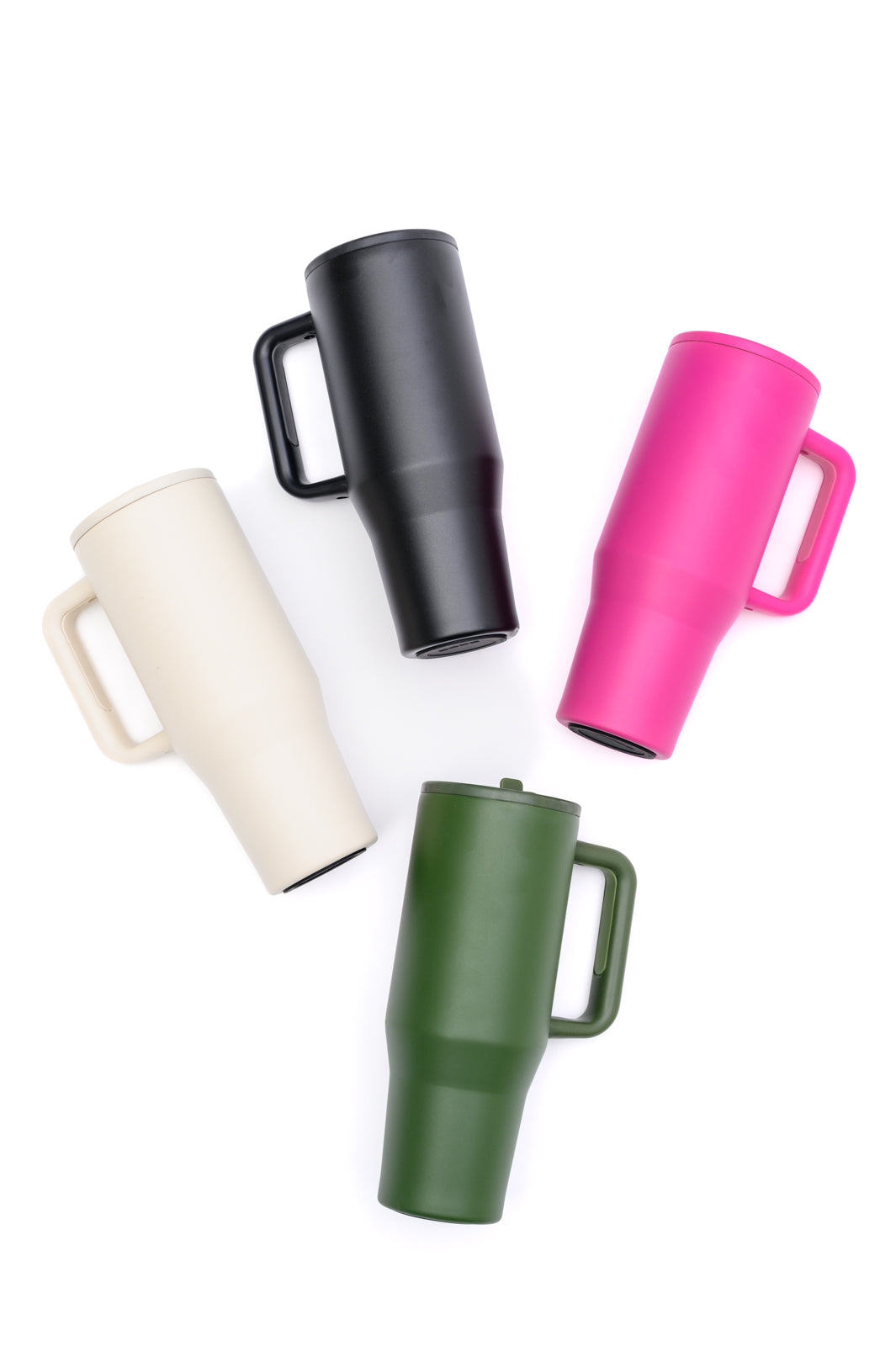 Five colorful tumblers in black, pink, white, green, and beige on a white background