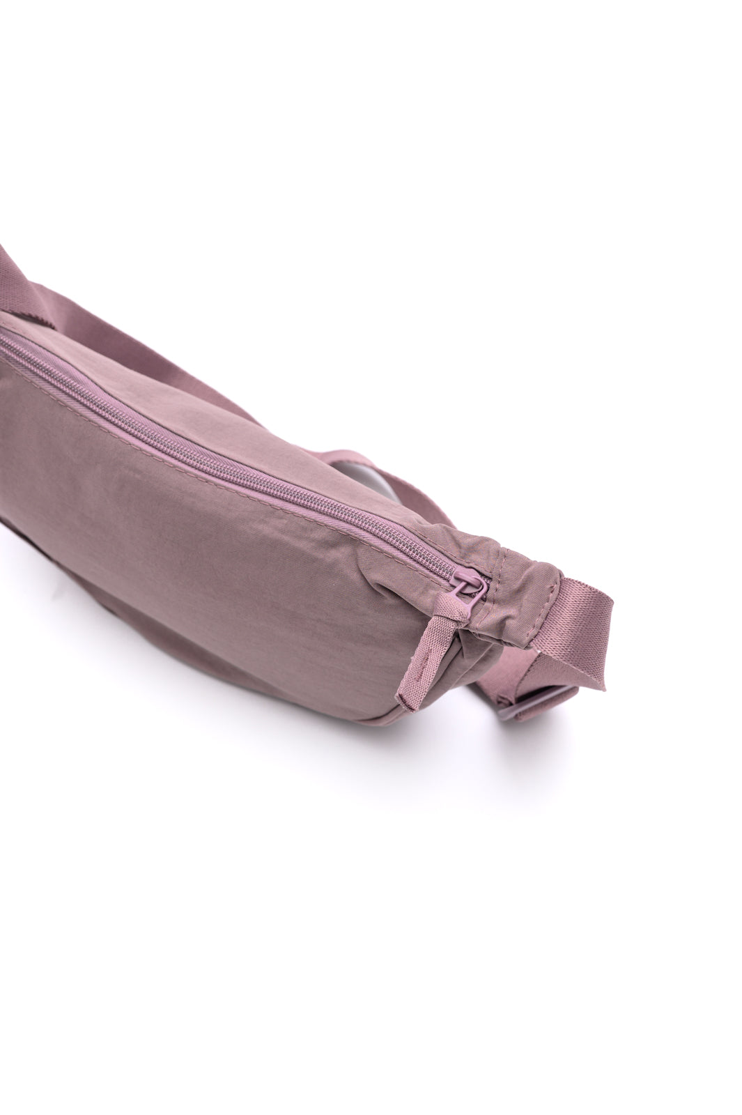 Lavender mini crossbody bag with dumpling silhouette and zipper closure