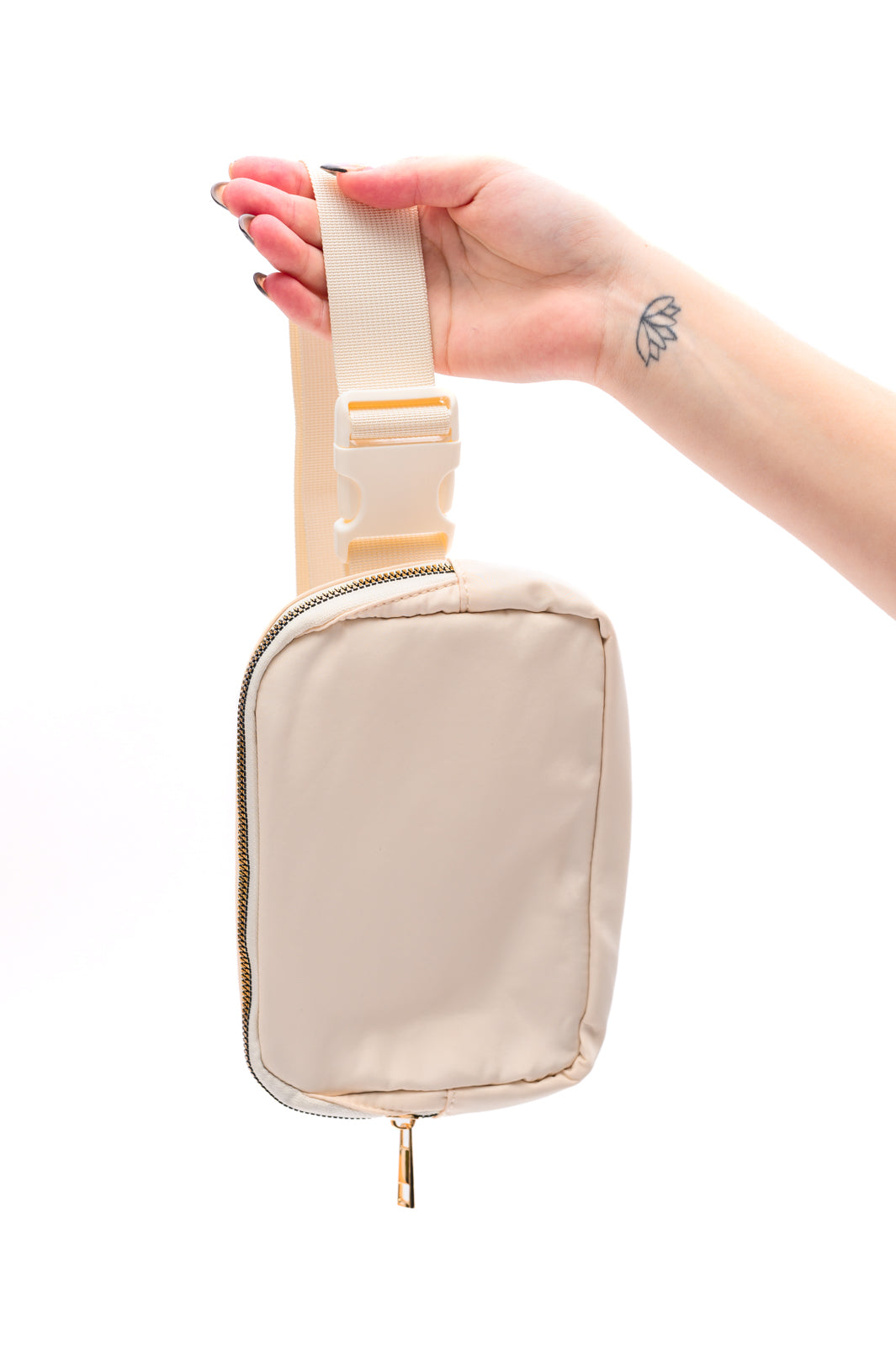 Ivory crossbody belt bag with gold hardware and adjustable strap