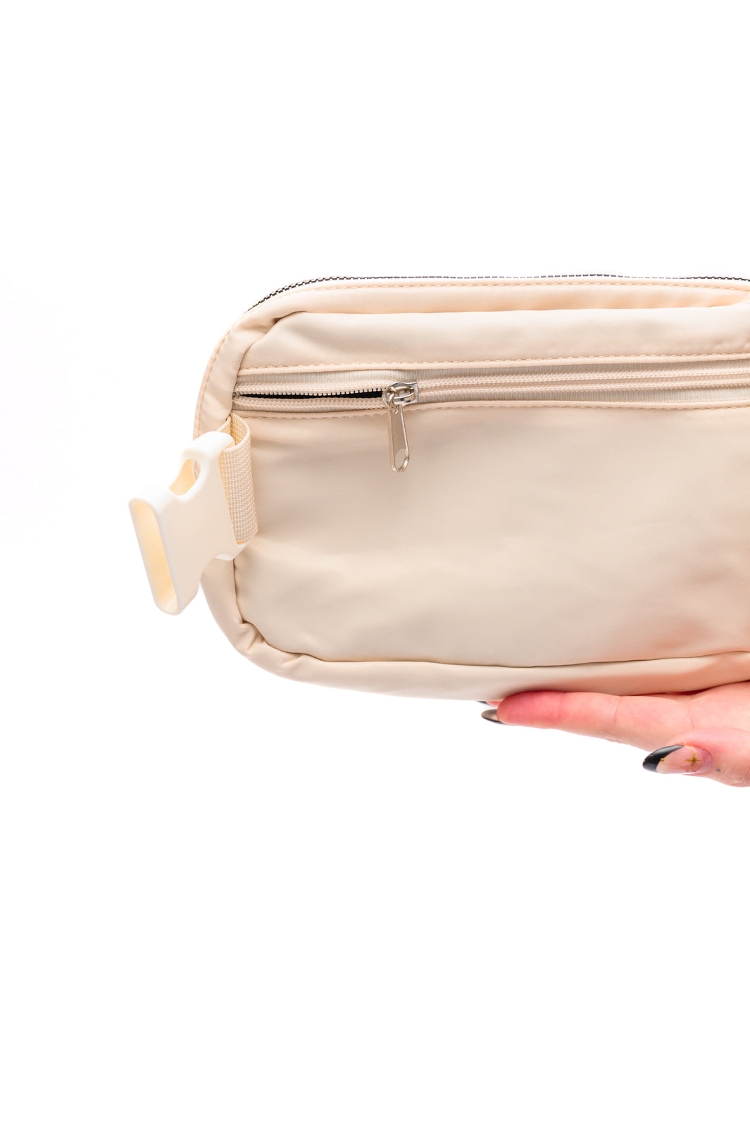 Ivory crossbody belt bag with gold hardware and adjustable strap