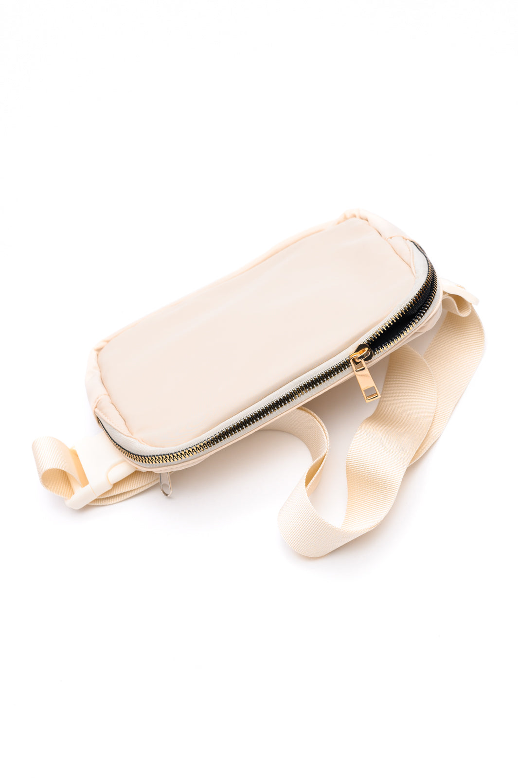 Ivory crossbody belt bag with gold hardware and adjustable strap