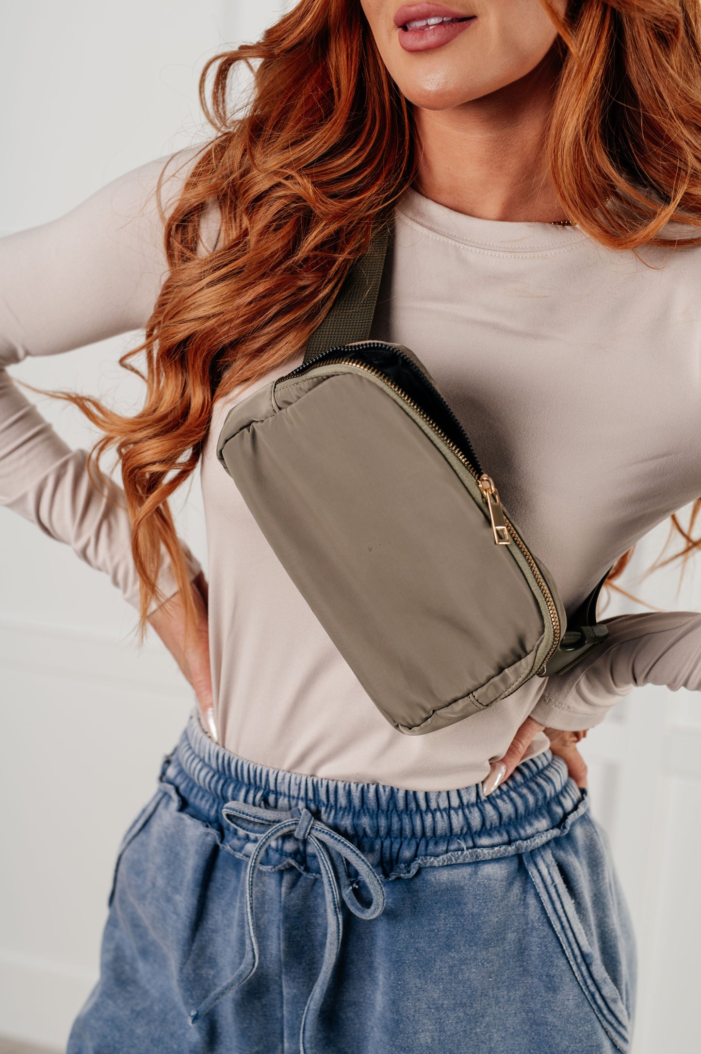 Olive crossbody belt bag with gold hardware and adjustable strap