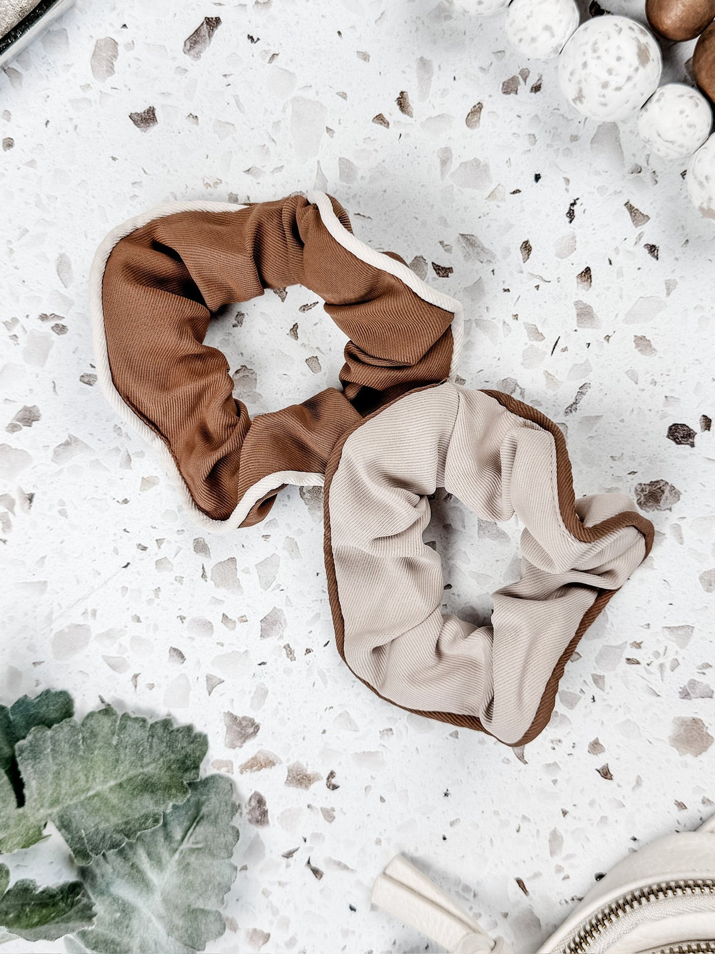 Set of two neutral scrunchies with ribbed fabric and contrast trim