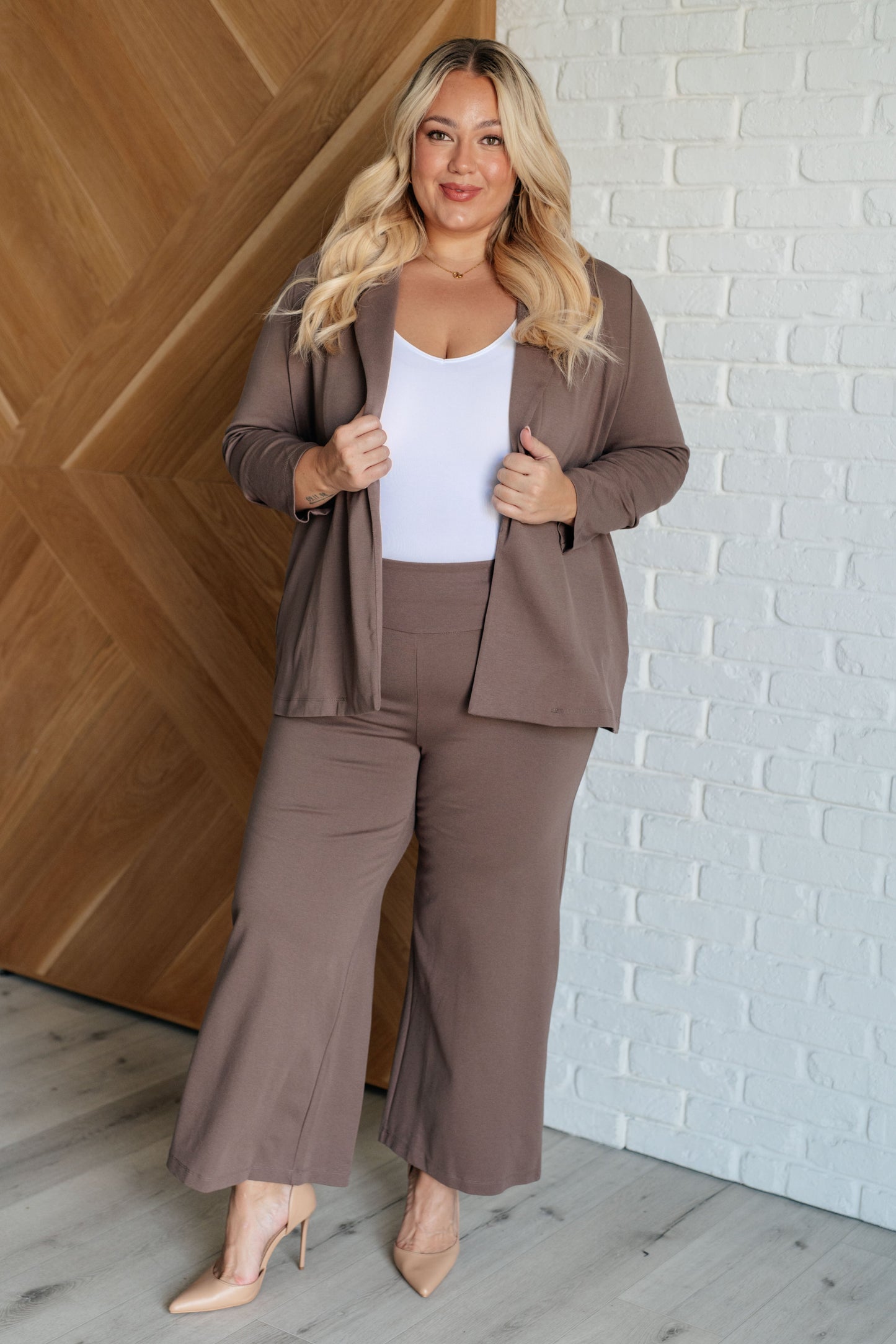 Model wearing Magic Wide Leg Crop Pants in dark mocha ponte knit with cropped wide leg design and high stretch fit.