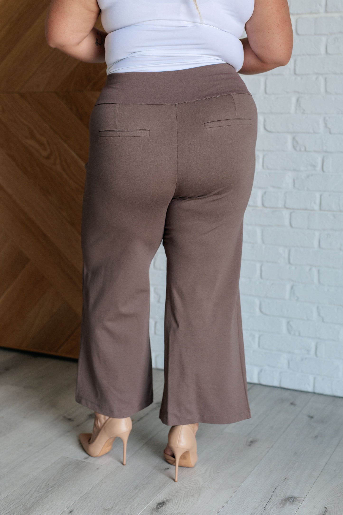 Model wearing Magic Wide Leg Crop Pants in dark mocha 
Ponte knit with cropped wide leg design and high stretch fit.