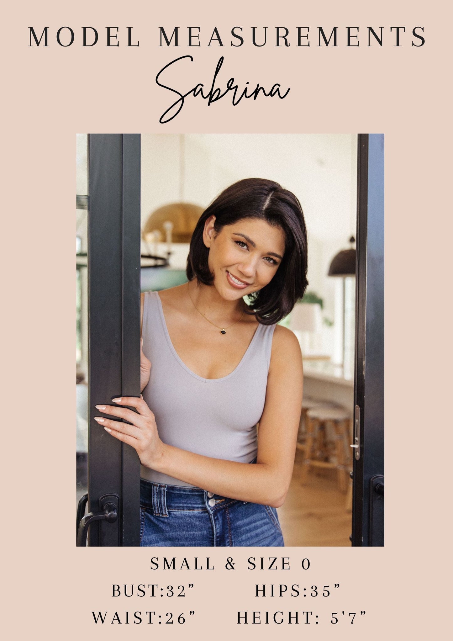Sabrina standing in a doorway with model measurements displayed
