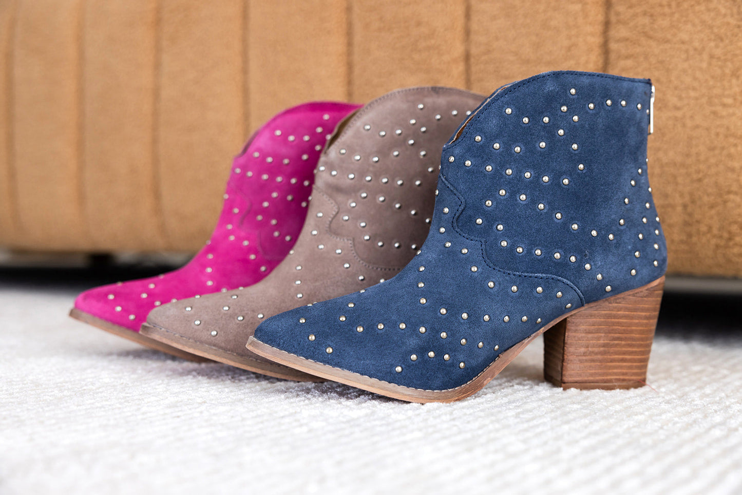Denim blue suede ankle boot with studs and stacked heel