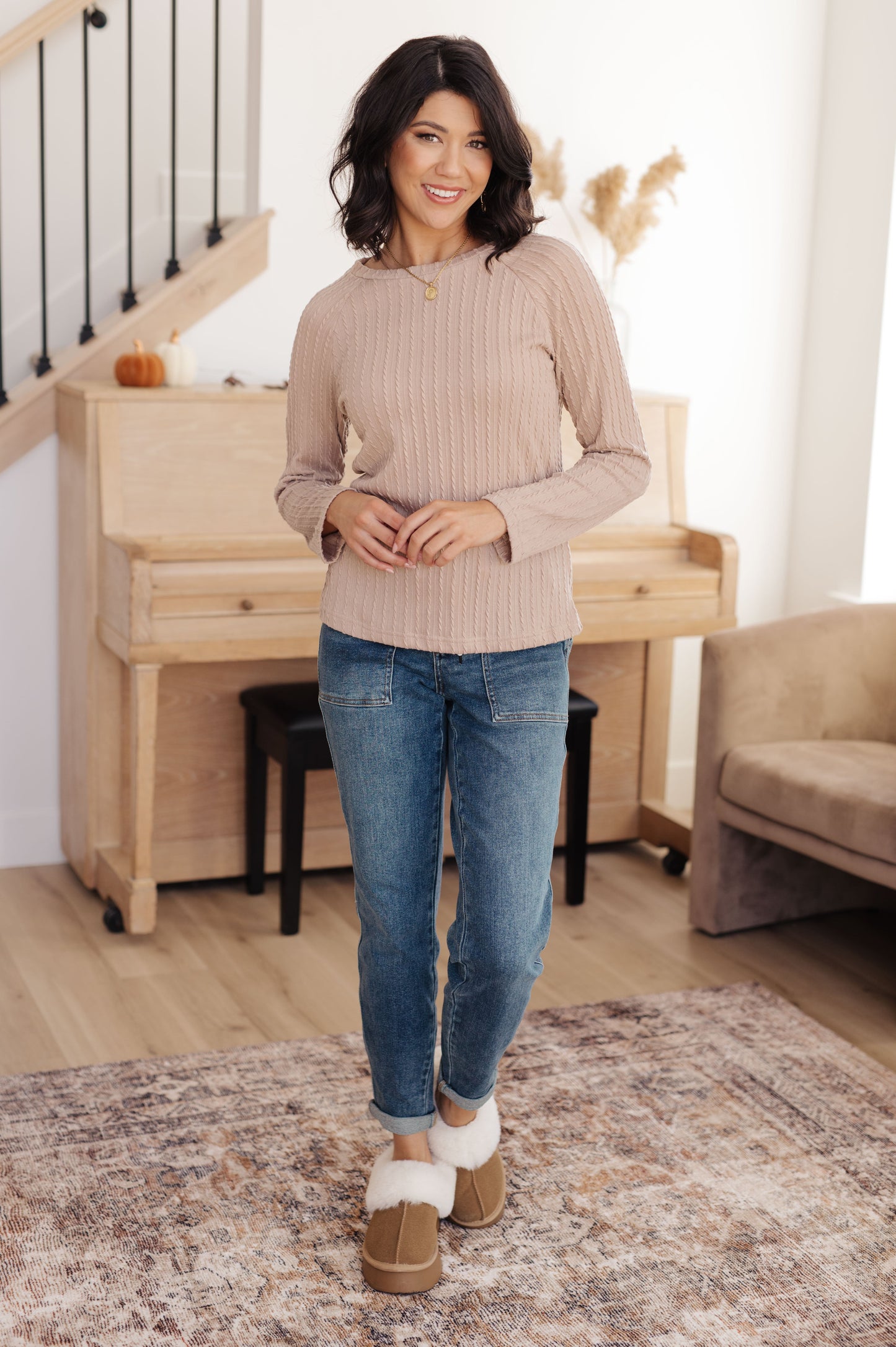 Woman wearing the Winding Down Cable Detail Top in soft textured knit with raglan sleeves.