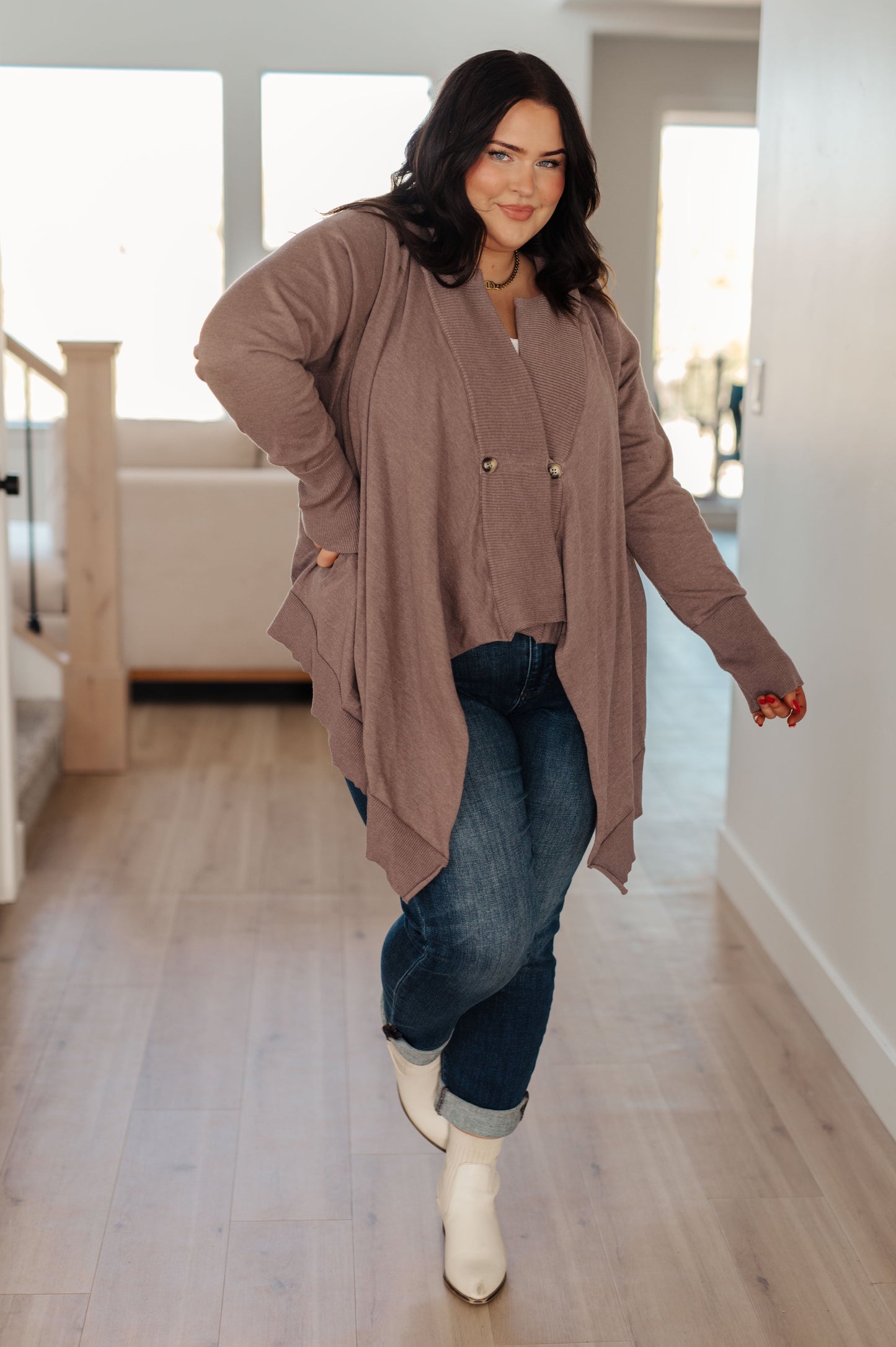 Woman wearing the You’ve Got Options Cardigan in taupe with hood, ribbed knit accents, and waterfall hem.