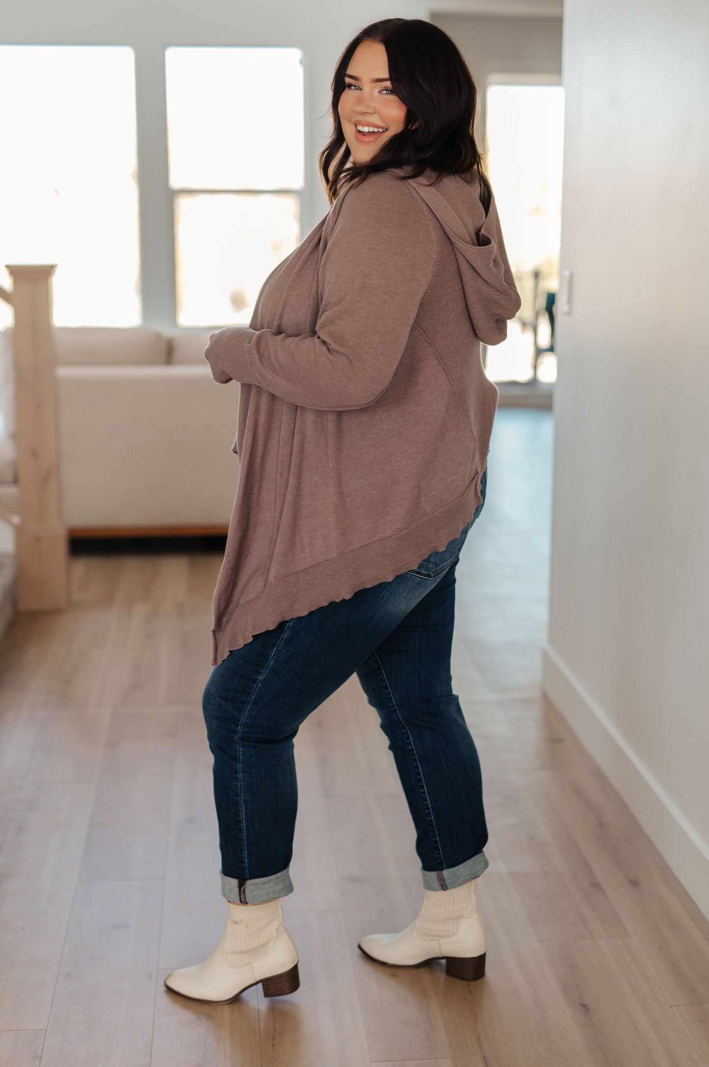 Woman wearing the You’ve Got Options Cardigan in taupe with hood, ribbed knit accents, and waterfall hem.