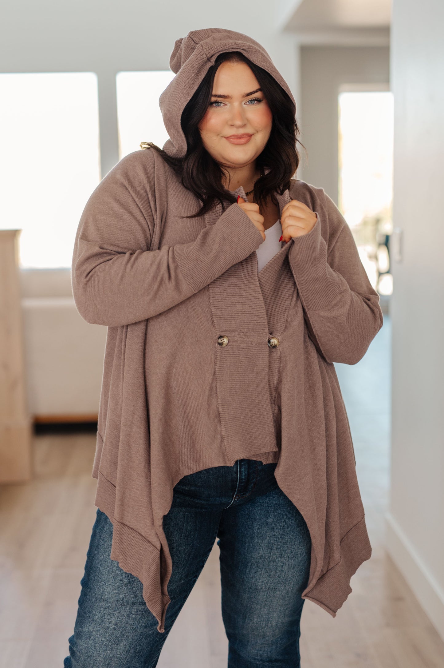 Woman wearing the You’ve Got Options Cardigan in taupe with hood, ribbed knit accents, and waterfall hem.