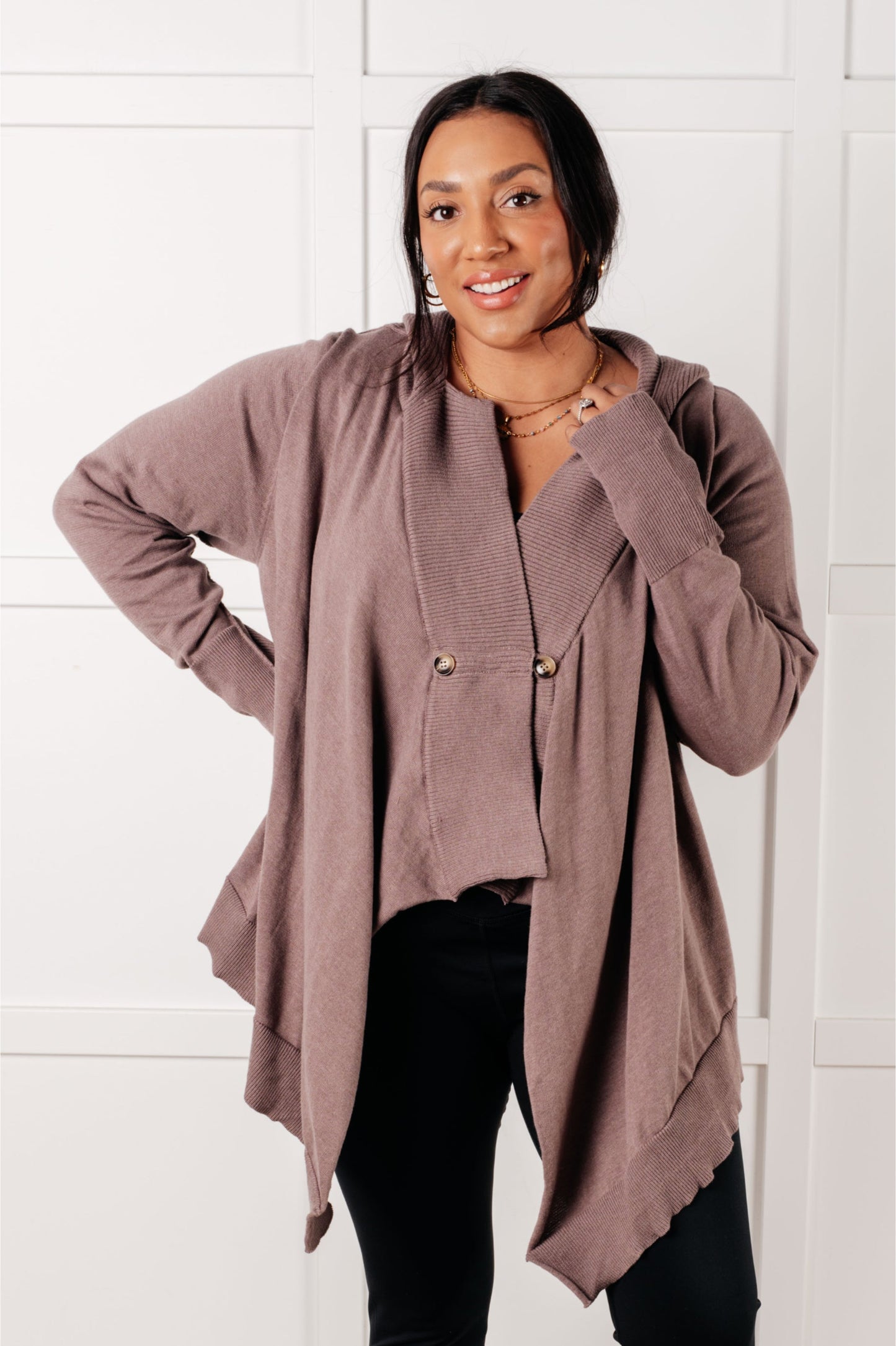 Woman wearing the You’ve Got Options Cardigan in taupe with hood, ribbed knit accents, and waterfall hem.