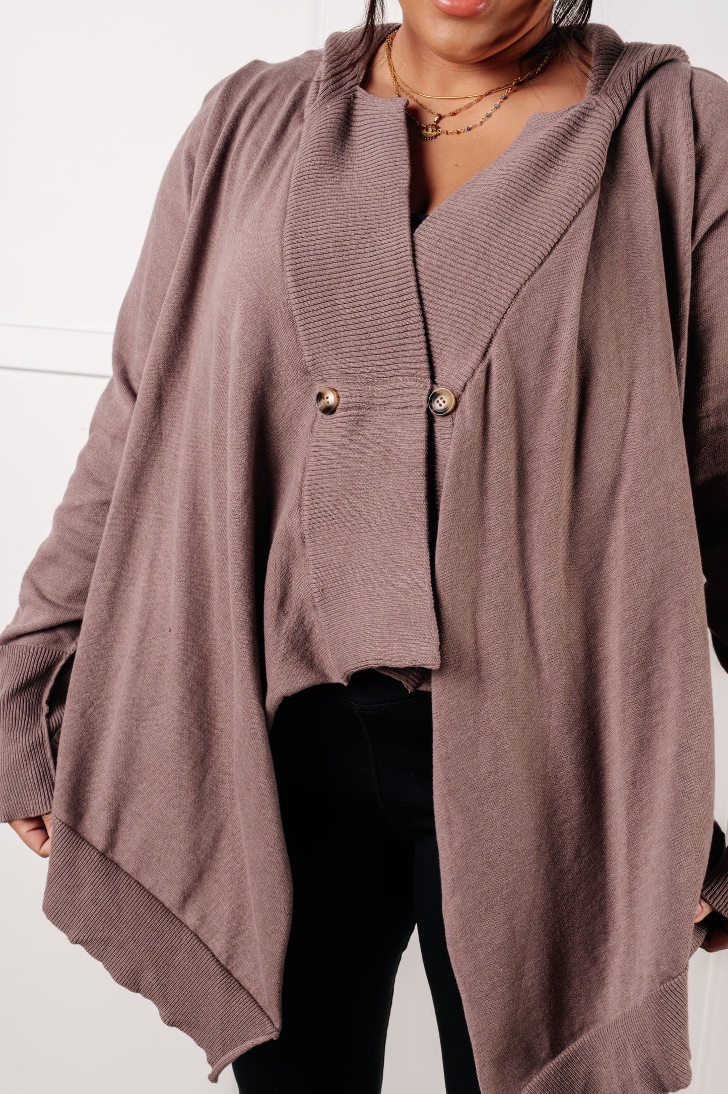 Woman wearing the You’ve Got Options Cardigan in taupe with hood, ribbed knit accents, and waterfall hem.