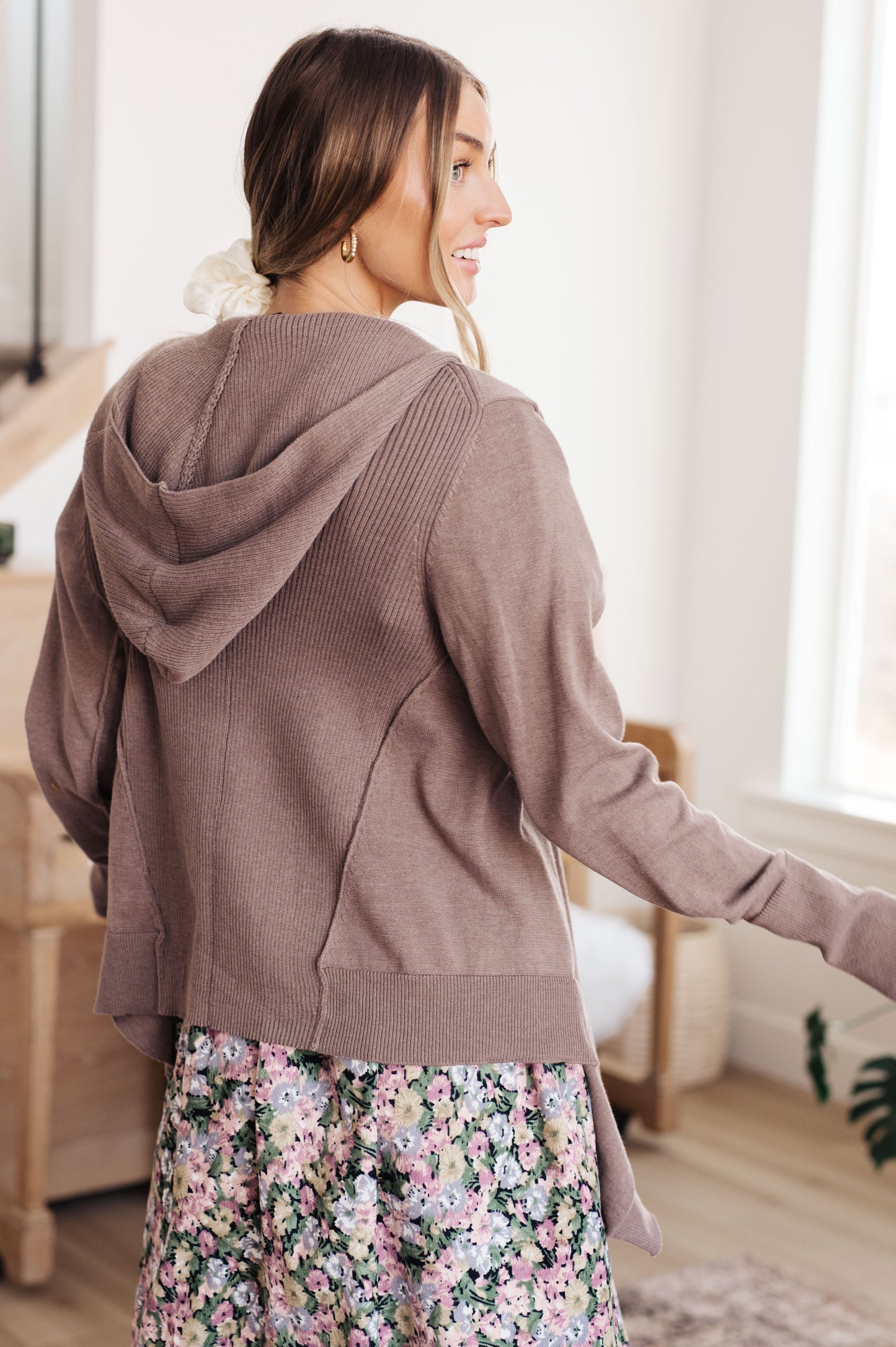 Woman wearing the You’ve Got Options Cardigan in taupe with hood, ribbed knit accents, and waterfall hem.