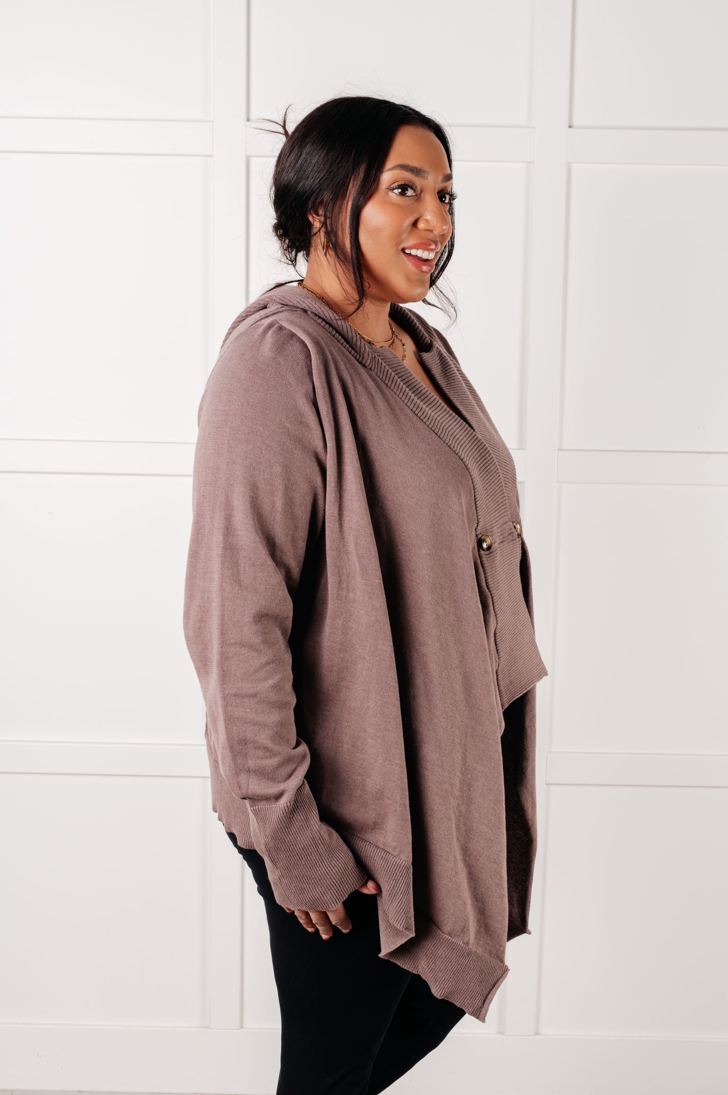 Woman wearing the You’ve Got Options Cardigan in taupe with hood, ribbed knit accents, and waterfall hem.