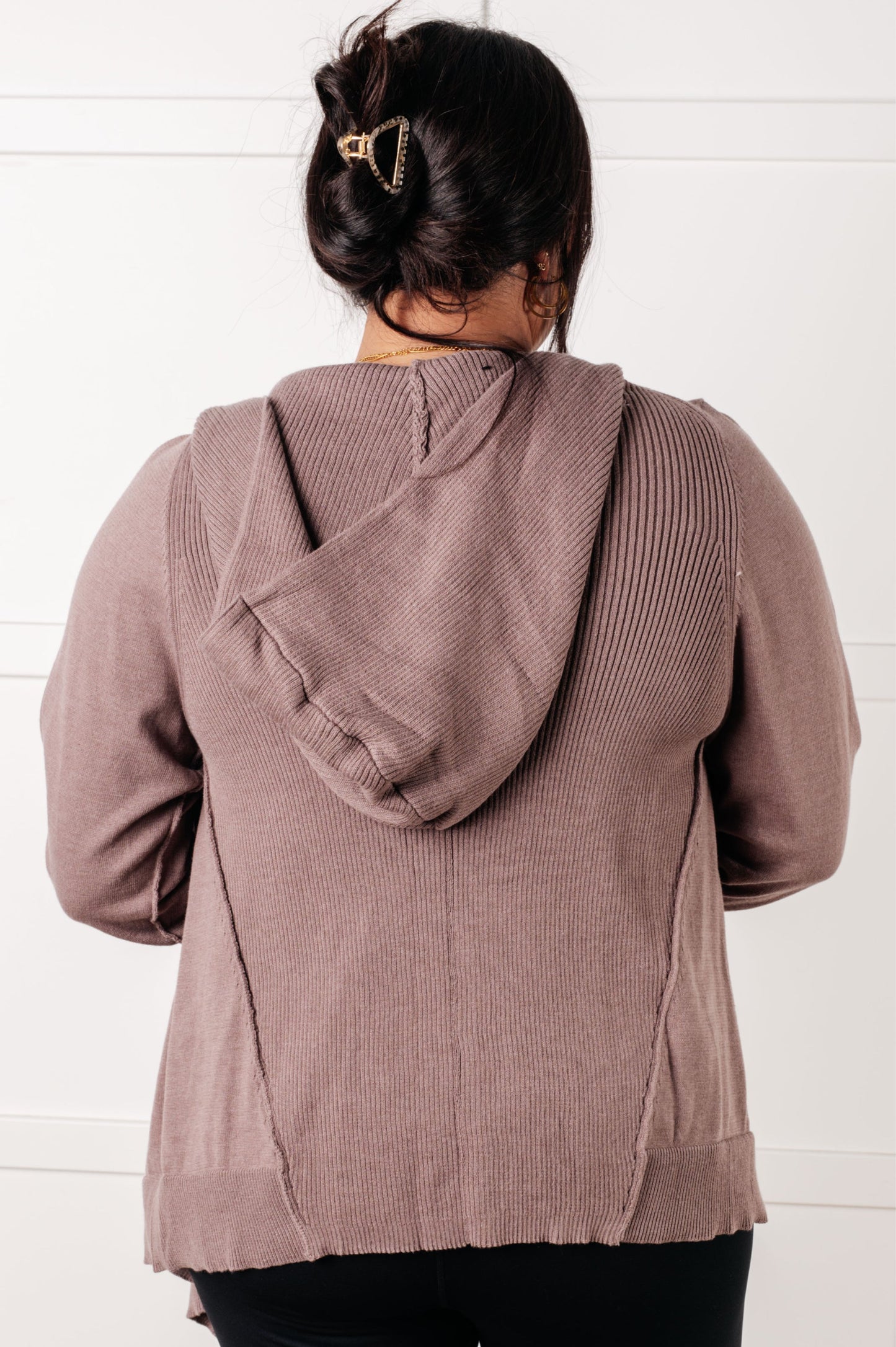 Woman wearing the You’ve Got Options Cardigan in taupe with hood, ribbed knit accents, and waterfall hem.