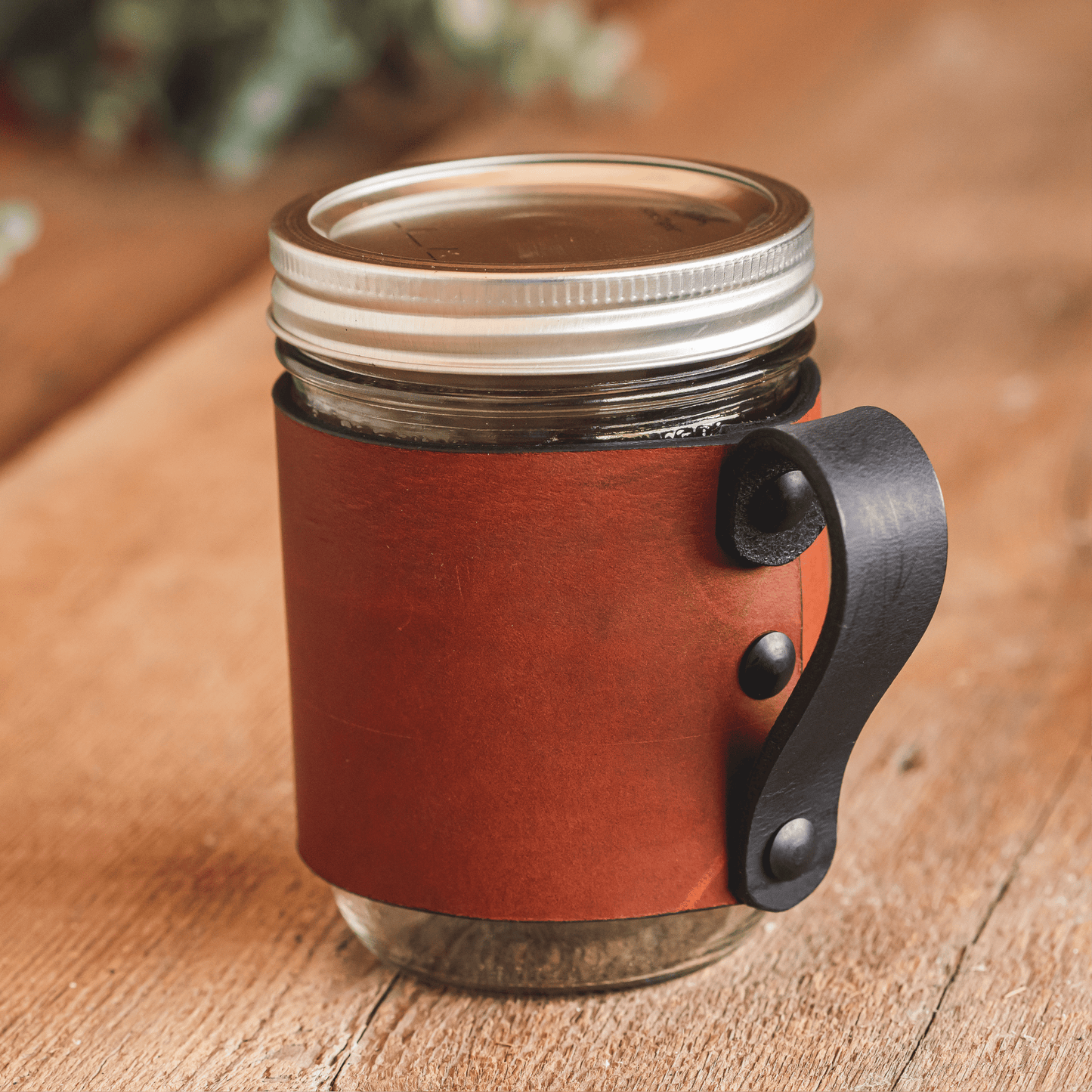 Leather mason jar sleeve with handle in brown, gray, and black full-grain leather, handmade in USA by Main Street Forge
