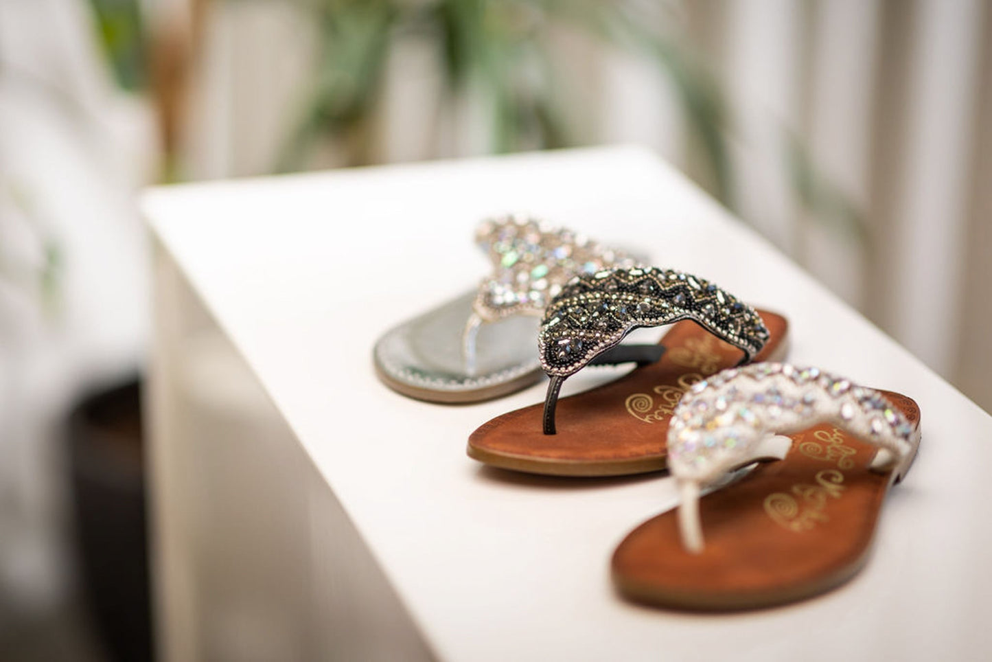 Black jeweled sandals with genuine leather footbed and ornate beaded design