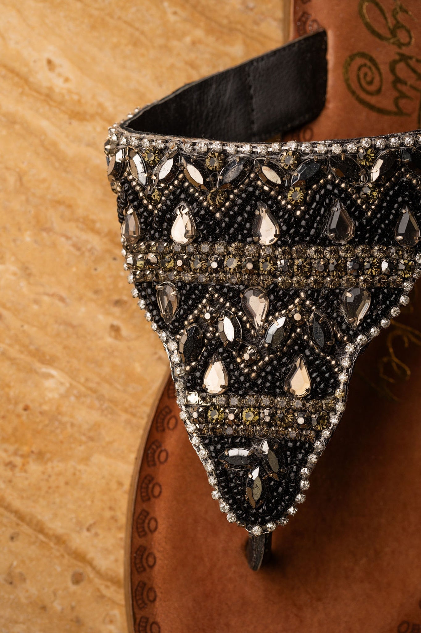 Black jeweled sandals with genuine leather footbed and ornate beaded design