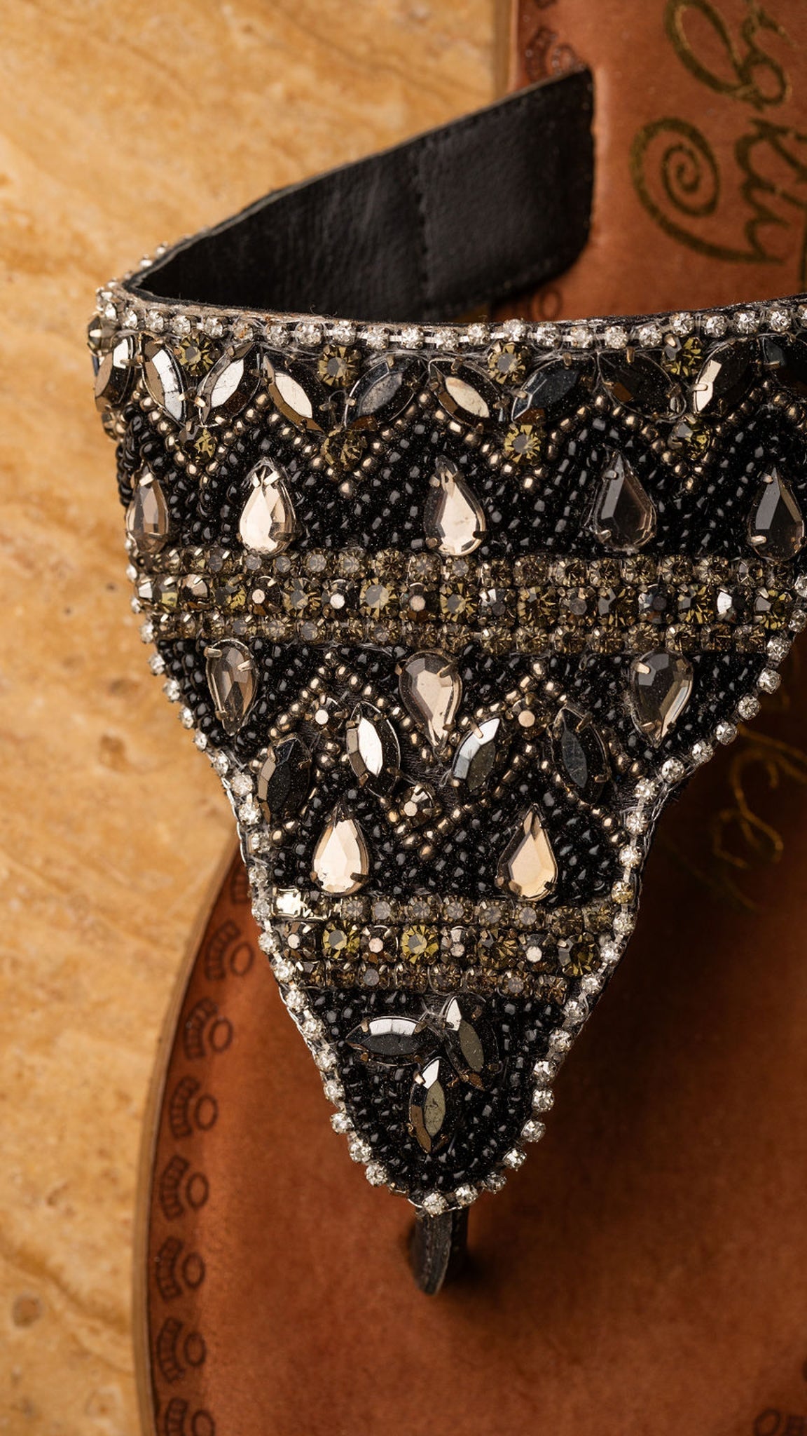 Black jeweled sandals with genuine leather footbed and ornate beaded design
