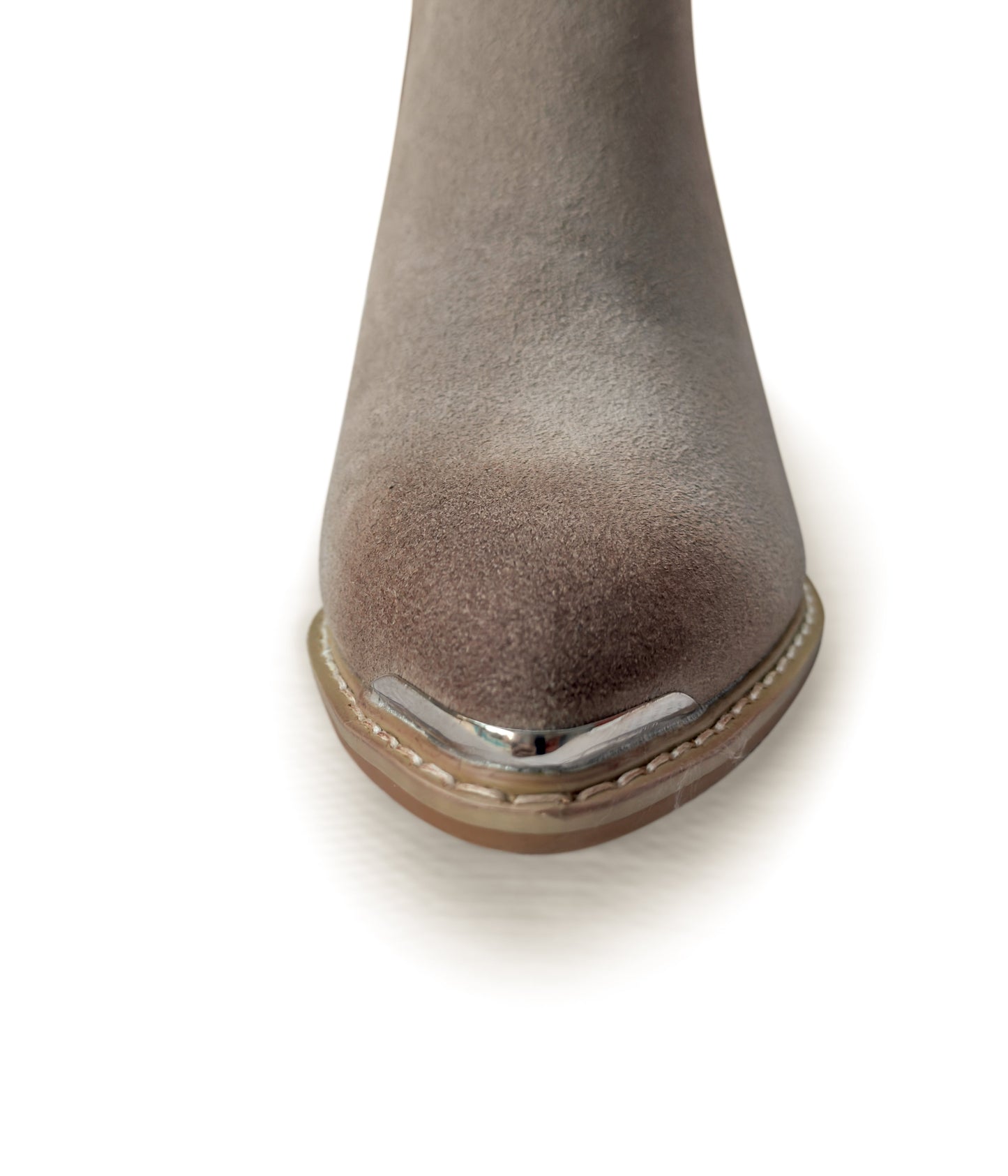 Close-up of a gray suede boot with a metallic heel on a white background
