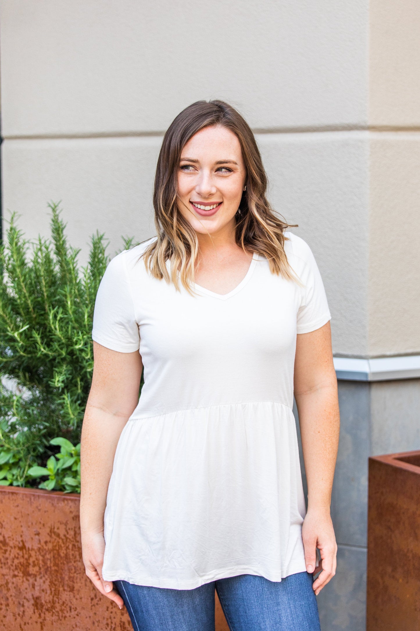 Michelle Mae Sarah Ruffle Top in Ivory with short sleeves and flowy fit