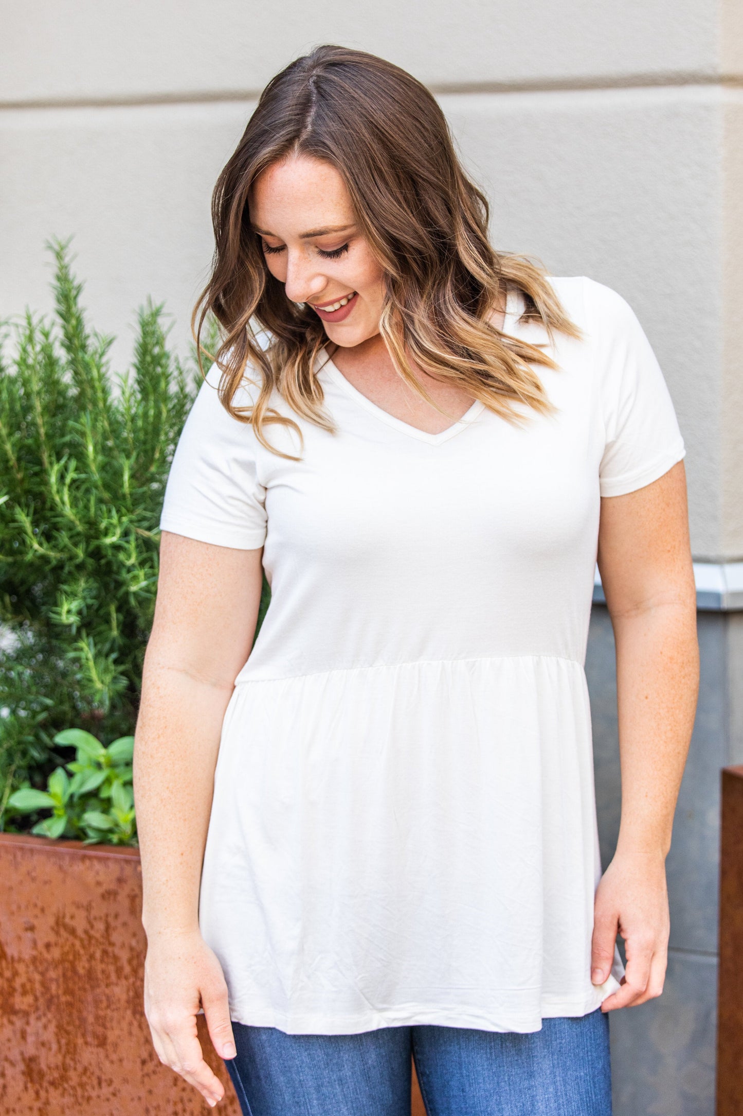 Michelle Mae Sarah Ruffle Top in Ivory with short sleeves and flowy fit