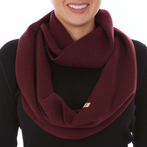 A model wearing a cozy burgundy infinity scarf, showcasing a chic accessory for versatile outfits.
