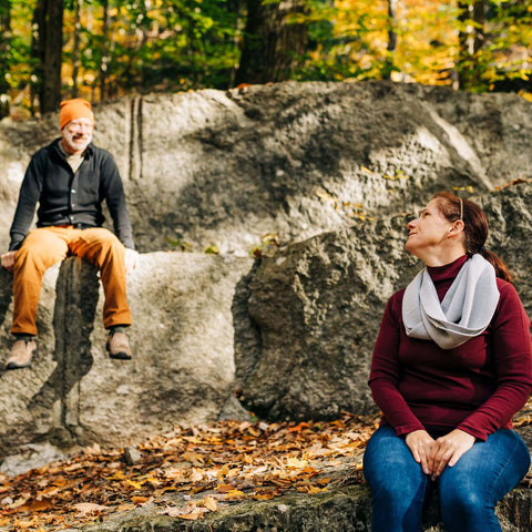 Two people enjoying the outdoors in autumn, wearing cozy Merino wool accessories by Minus33.
