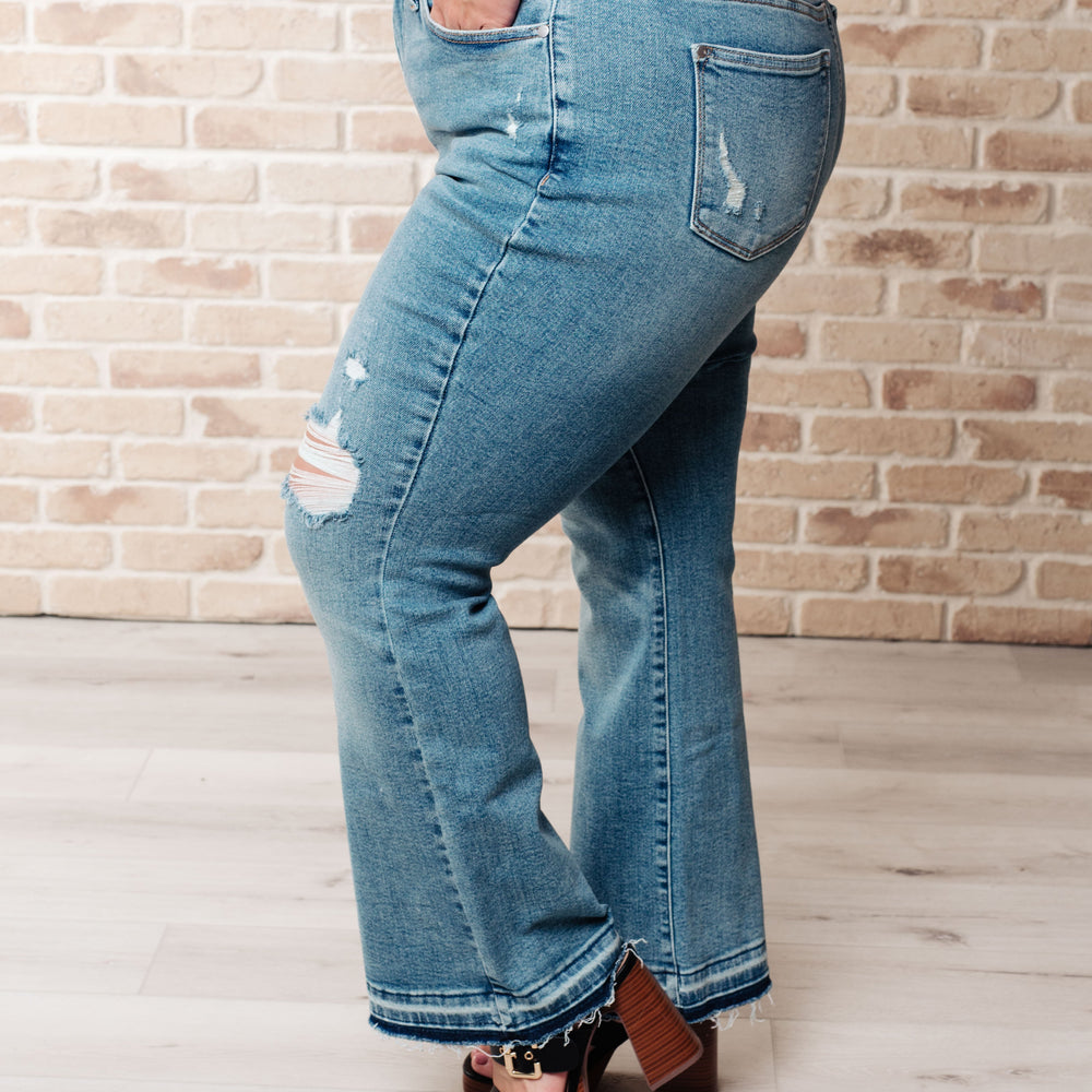 
                      
                        Isla Mid Rise Distressed Released Hem Bootcut Jeans
                      
                    