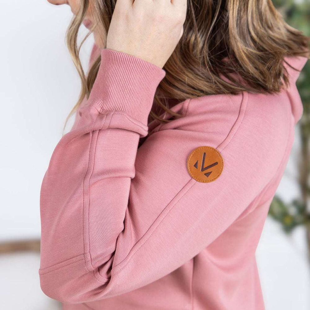 
                  
                    Close-up of a smiling model wearing the Scuba FullZip Hoodie in Rose, featuring a front zipper closure, cozy hood, and relaxed fit.
                  
                