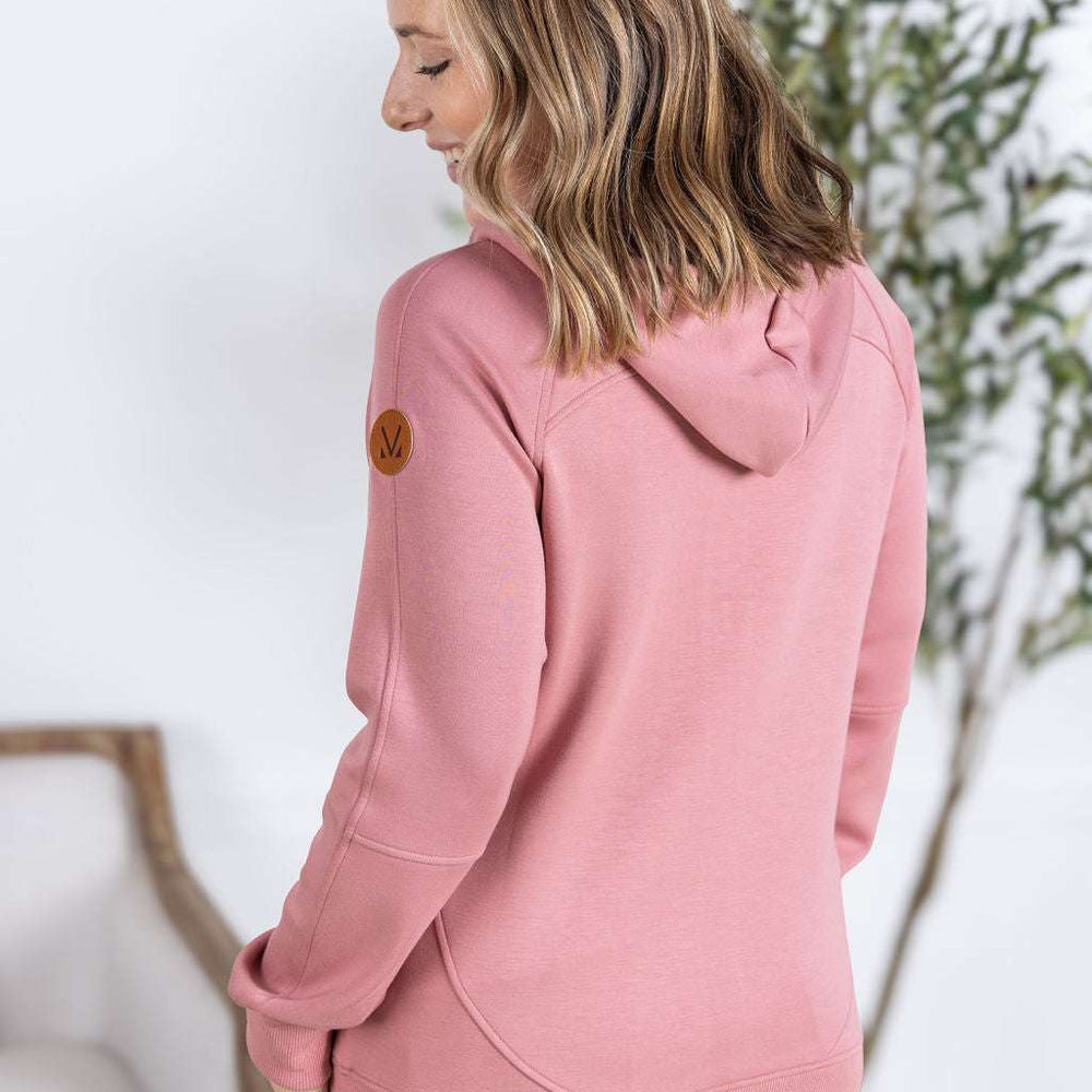 
                  
                    Close-up of a smiling model wearing the Scuba FullZip Hoodie in Rose, featuring a front zipper closure, cozy hood, and relaxed fit.
                  
                