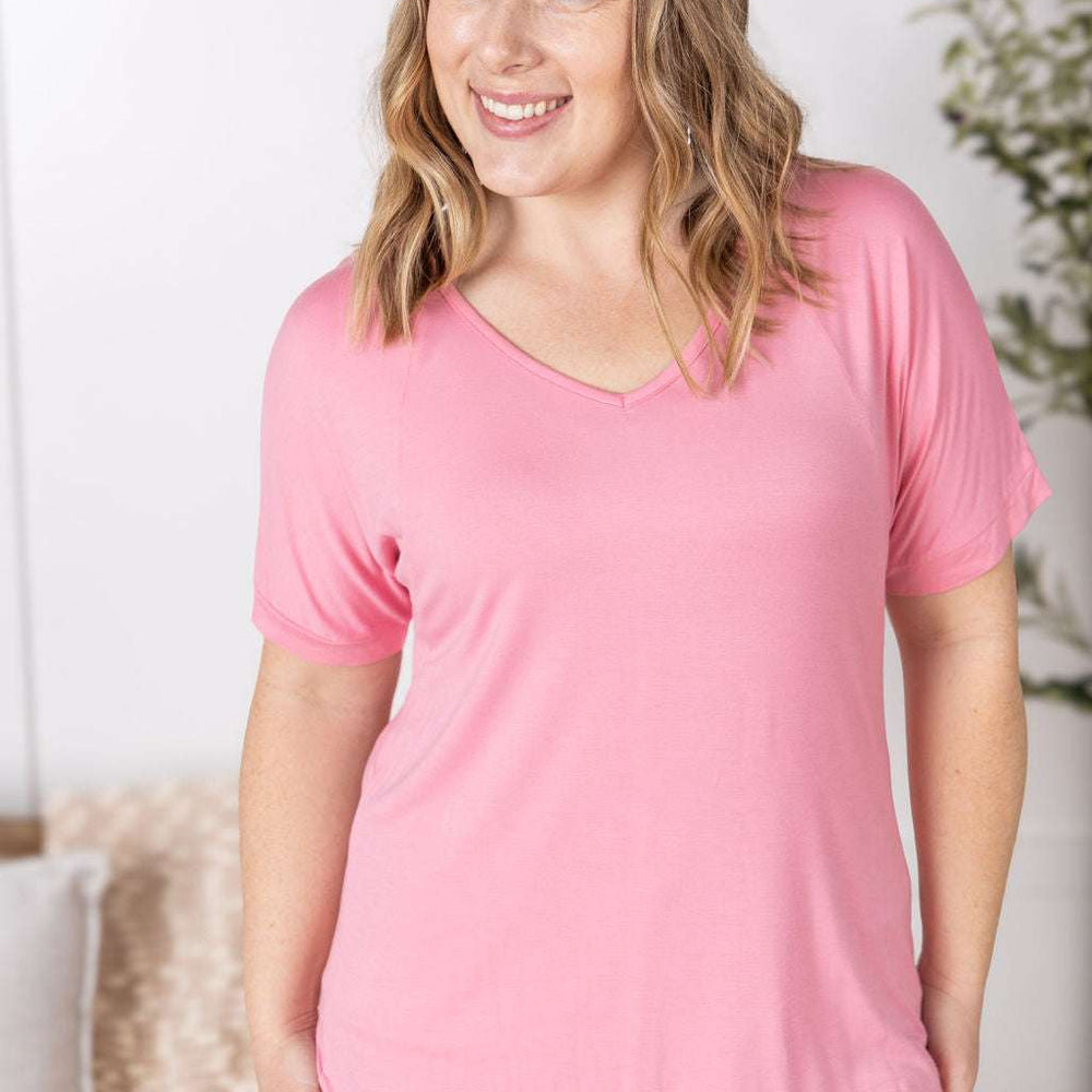 Close-up of a smiling model wearing the Bamboo V Neck Tee in rose by Michelle Mae, featuring a flattering v-neckline, short sleeves, and comfortable relaxed fit