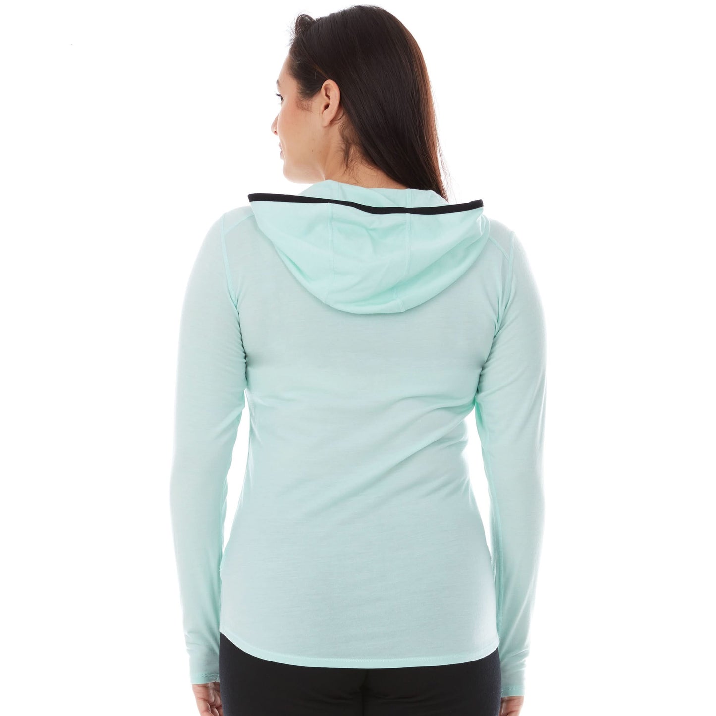 Woman wearing mint merino wool 1/4 zip sun hoodie with hood and thumbholes