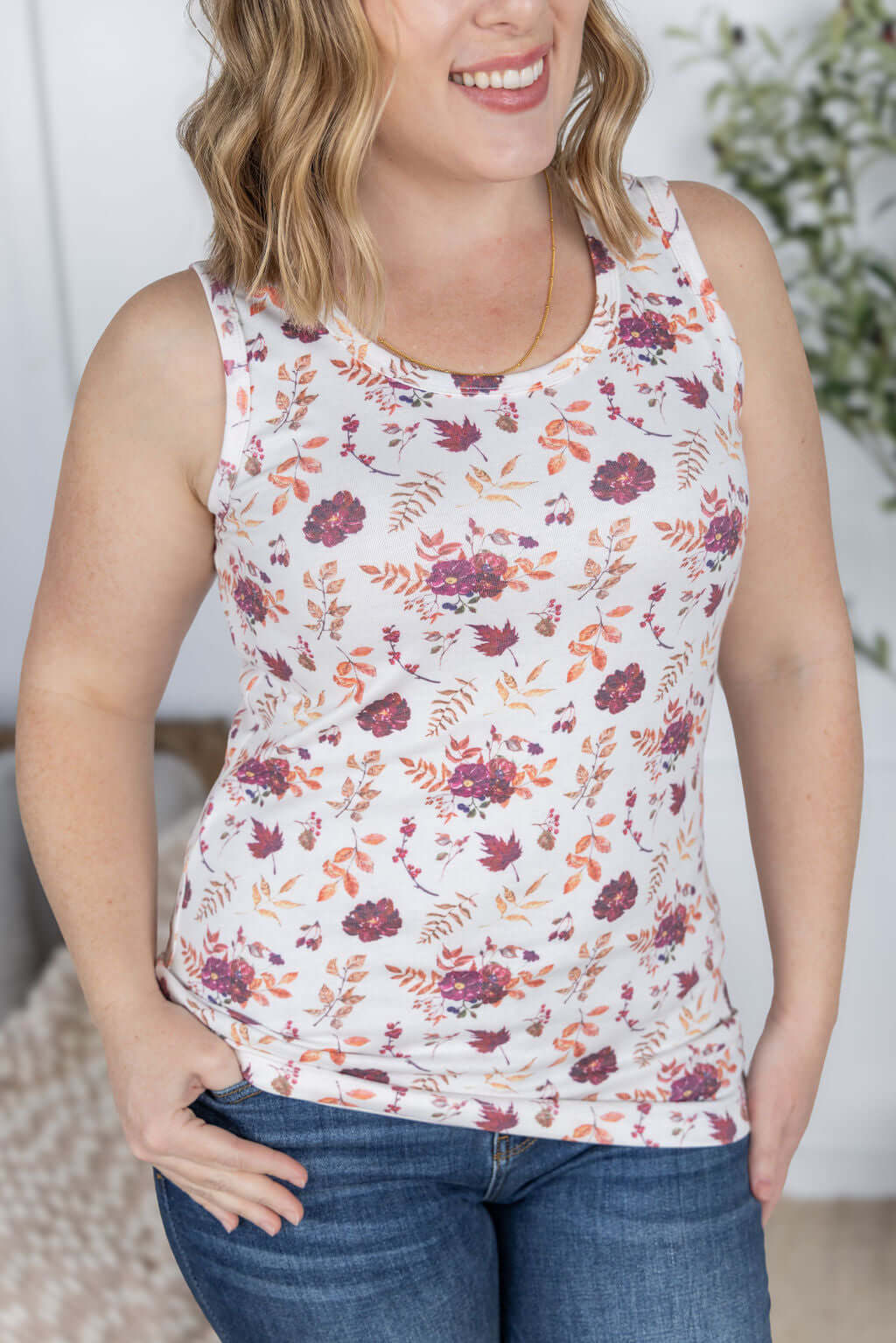 Woman wearing Ava Tank in Autumn Bloom floral print