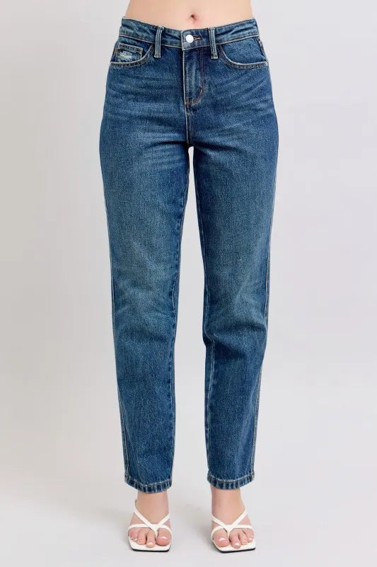 Woman wearing Margo medium wash high waisted rigid straight leg jeans with cropped ankle length