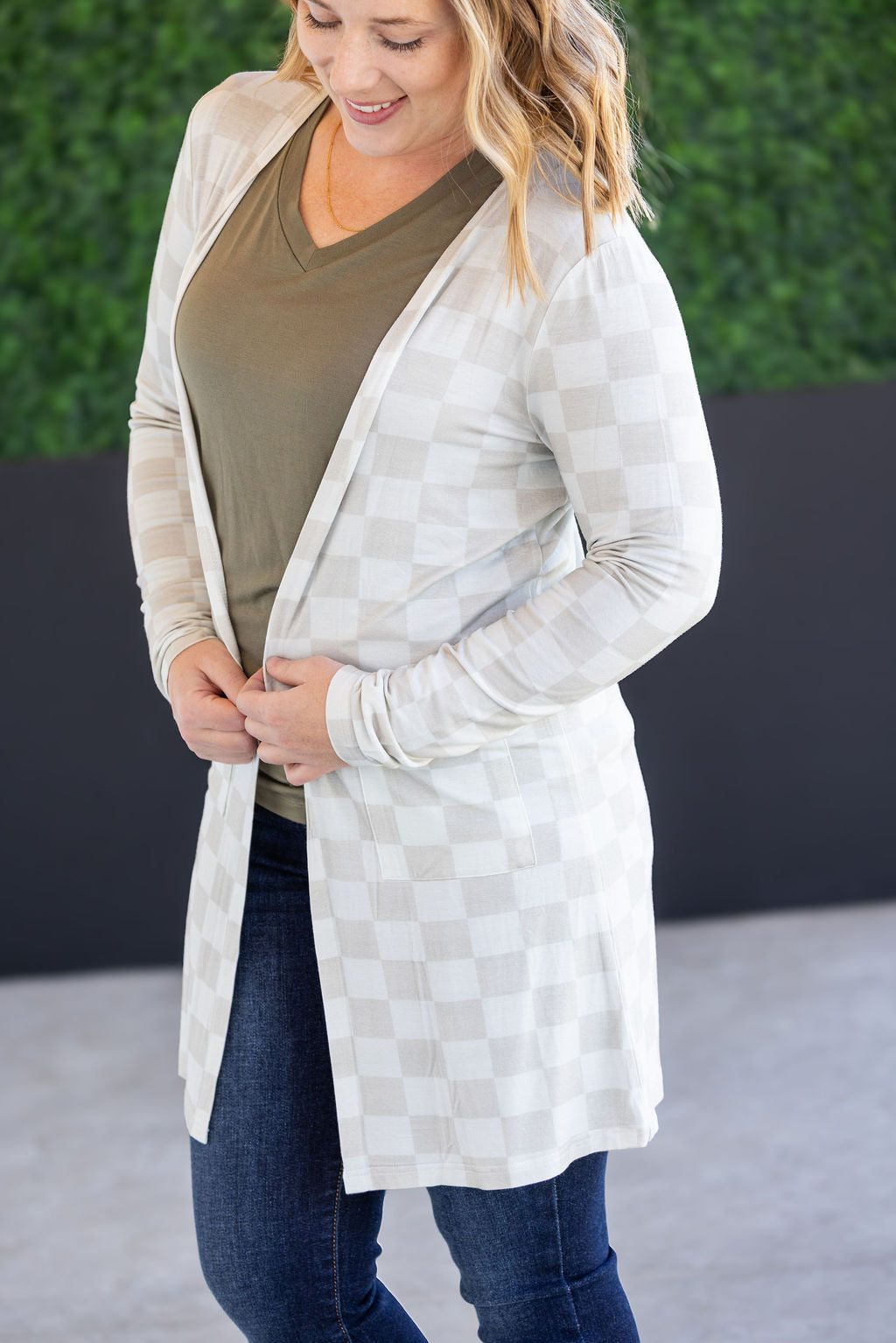 Classic Cardigan in Neutral Checkers with open front and pockets.