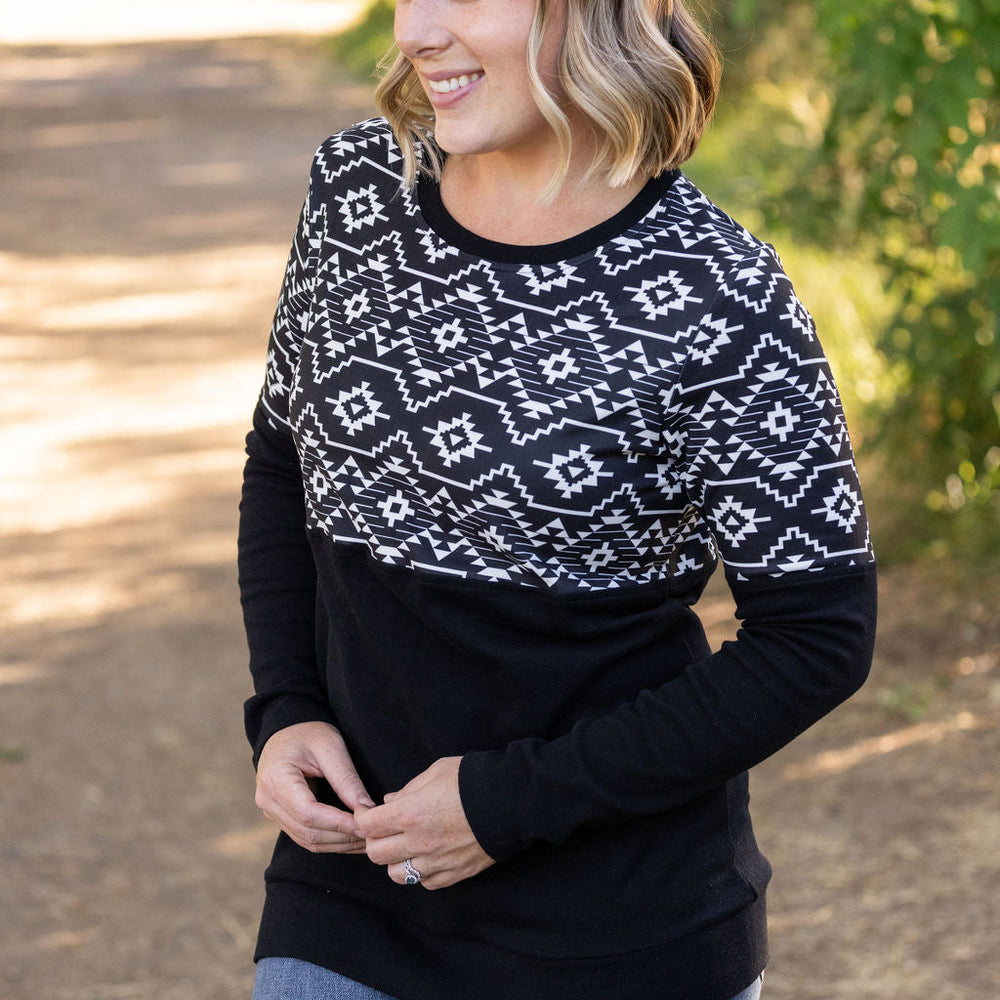 
                      
                        Natalie Pullover - Black Geometric
                      
                    