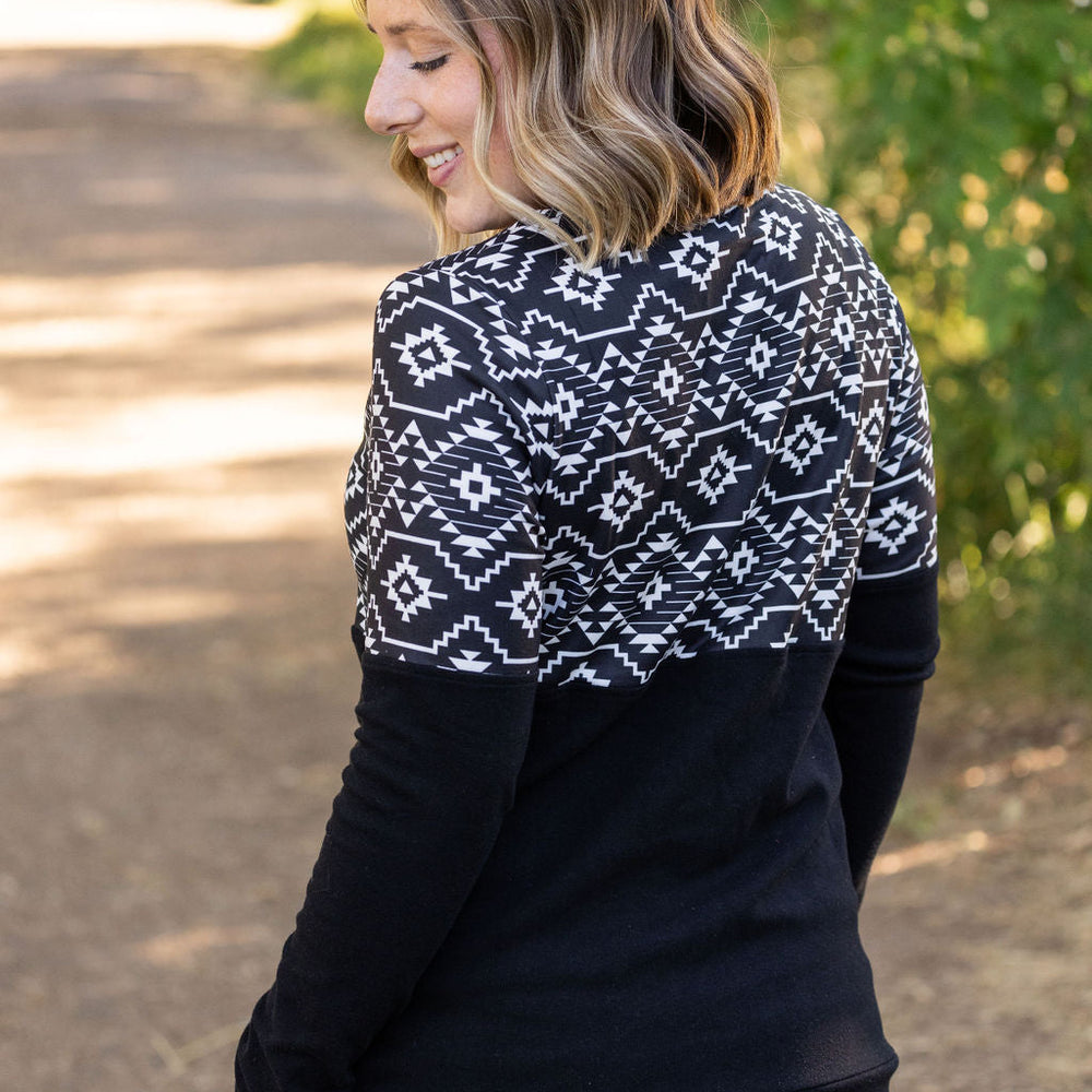 
                      
                        Natalie Pullover - Black Geometric
                      
                    