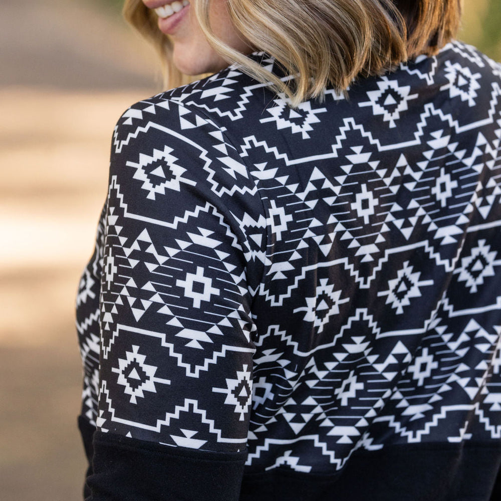 
                      
                        Natalie Pullover - Black Geometric
                      
                    