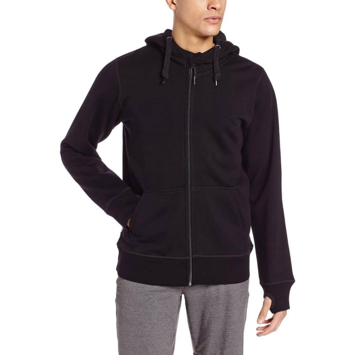 Man wearing black heavyweight merino wool hoodie with drawstring hood and thumbholes