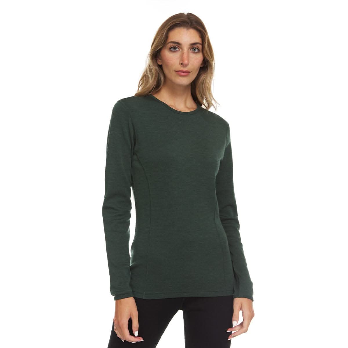 Woman wearing forest green merino wool midweight base layer crew top