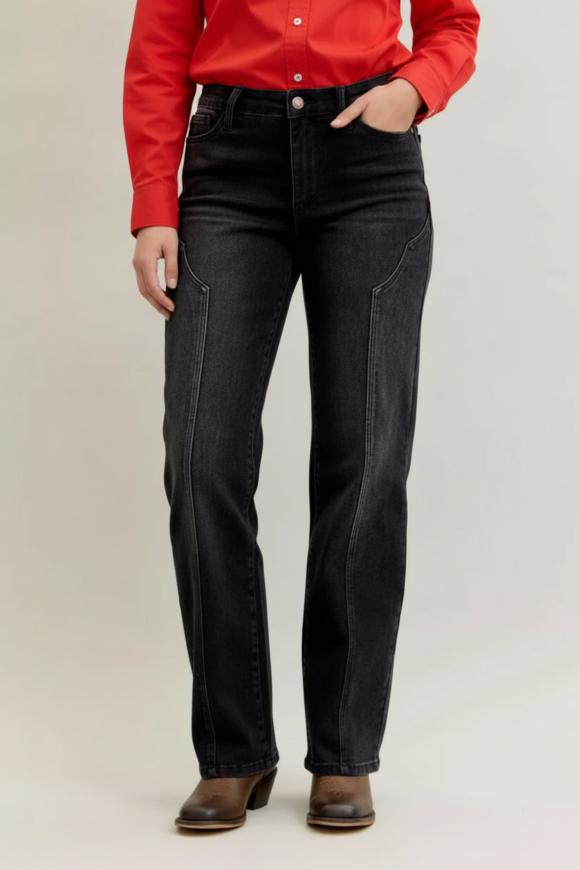 Woman wearing Oakley black straight leg jeans with distinctive western seam details down the front