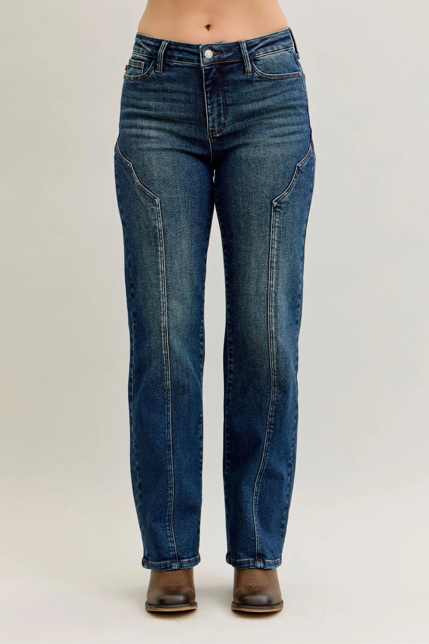 Woman wearing Dawson vintage blue high waisted straight leg jeans with distinctive seamline details down the front