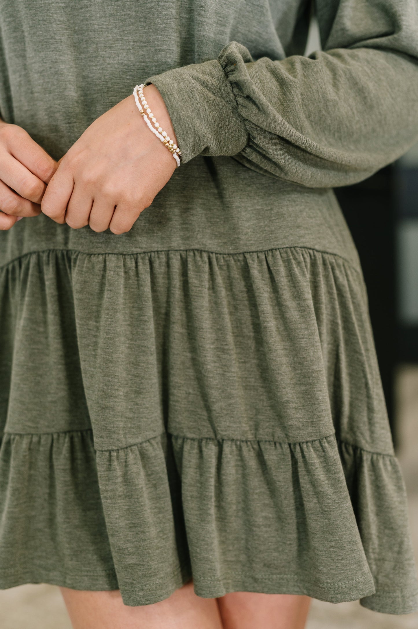  Olive long sleeve tiered mini dress with balloon sleeves and gathered ruffle hem