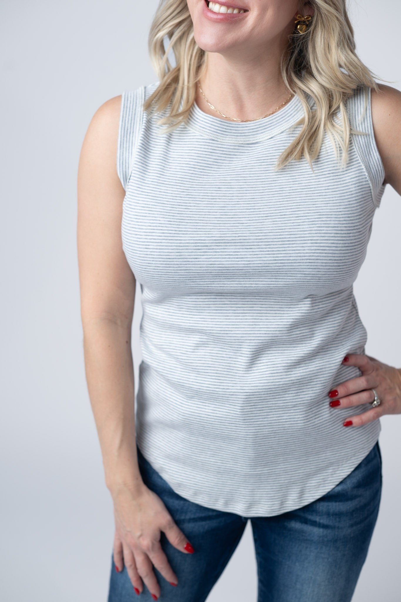 Women's micro striped tank top in Grey and white with scoop neckline, exposed stitch trim, and fitted silhouette