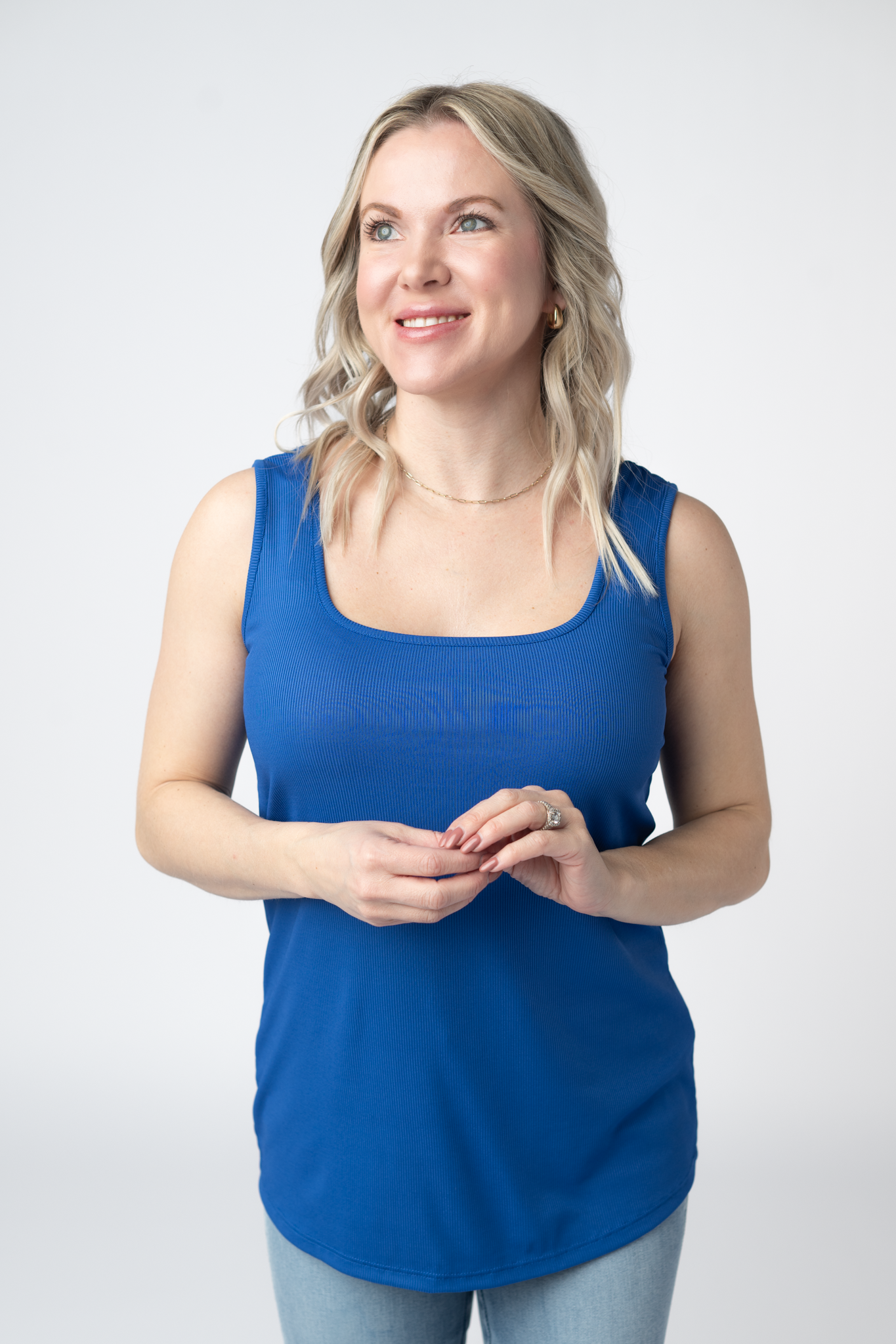 Woman wearing a royal blue Rachel Ribbed Tank with scoop neck and curved hem in lightweight ribbed fabric