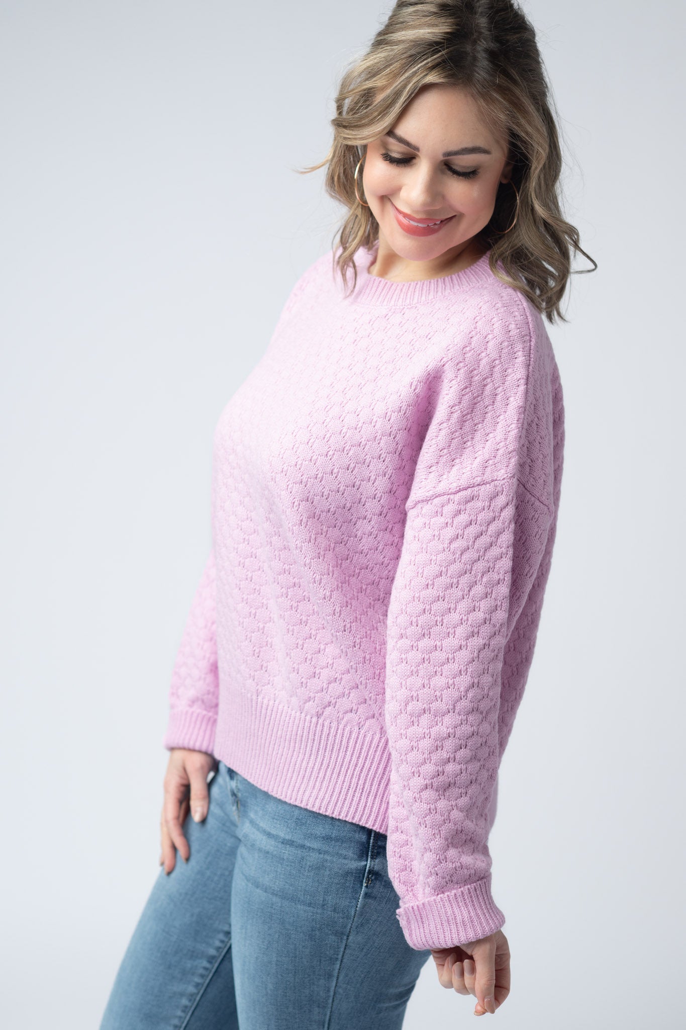 Women's textured pullover sweater in Pink with crew neck, honeycomb knit pattern, and ribbed cuffs and hem